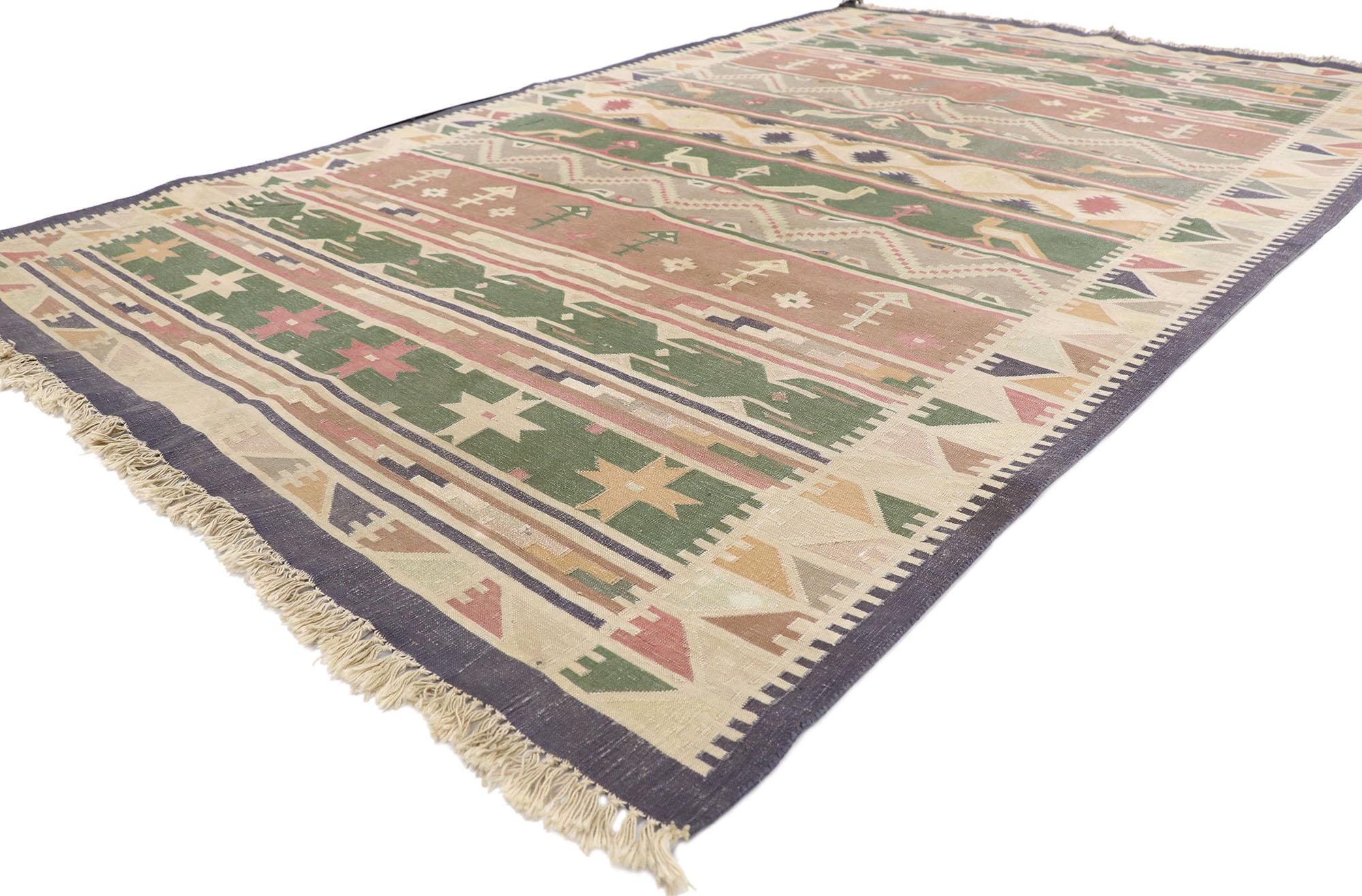 77985 vintage Indian stone wash Dhurrie rug with Folk Art style 05'05 x 08'07.?? Full of tiny details and a bold expressive design combined with with warm earth-tone colors and folk art tribal style, this hand-woven wool vintage Indian stone washed