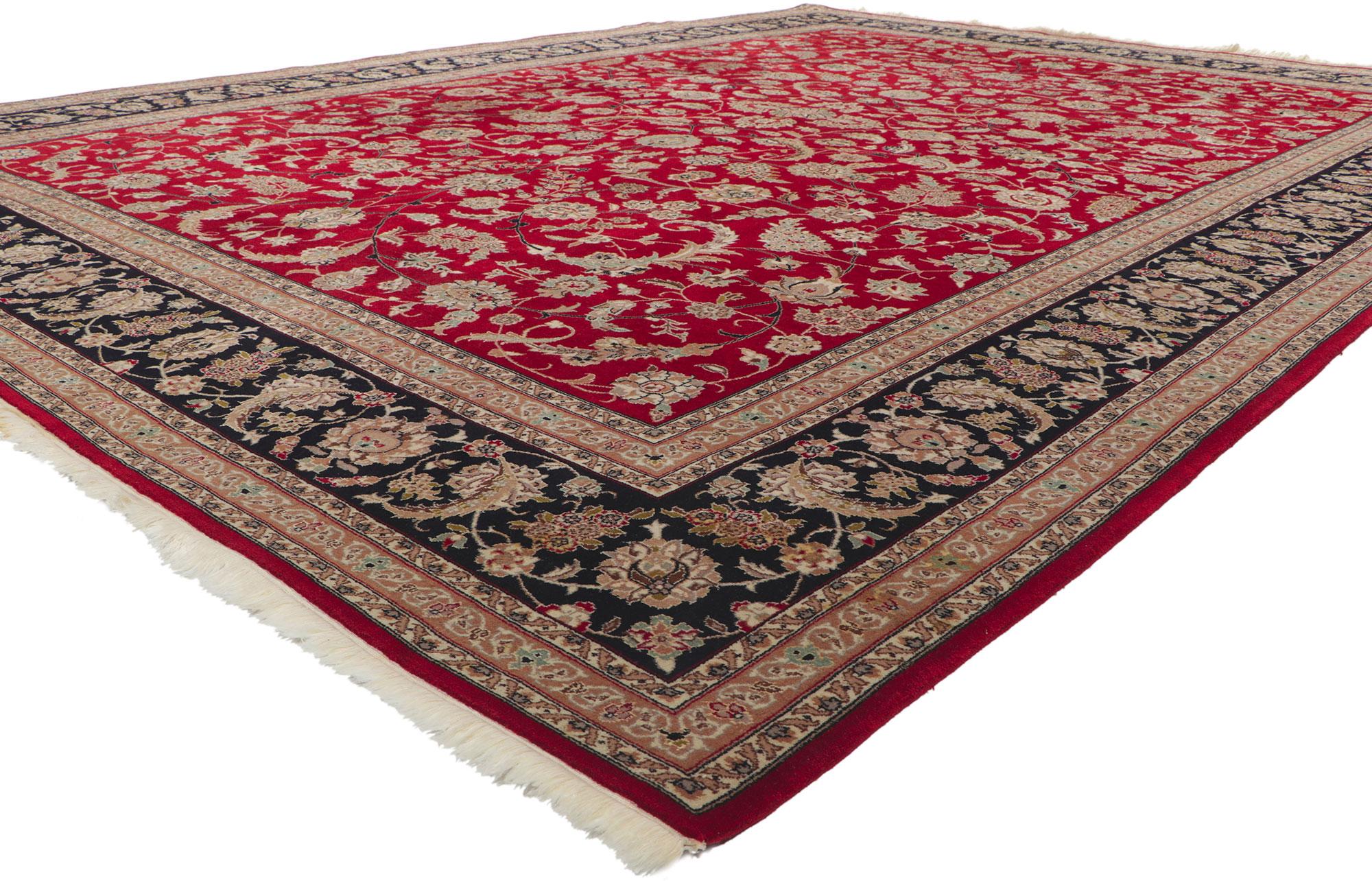 ?78360 Vintage Indian Tabriz wool and silk rug, 09'09 x 13'07. With timeless appeal and ornate decorative detailing, this wool and silk vintage Indian Tabriz rug is a captivating vision of woven beauty. The red field is covered in an allover floral