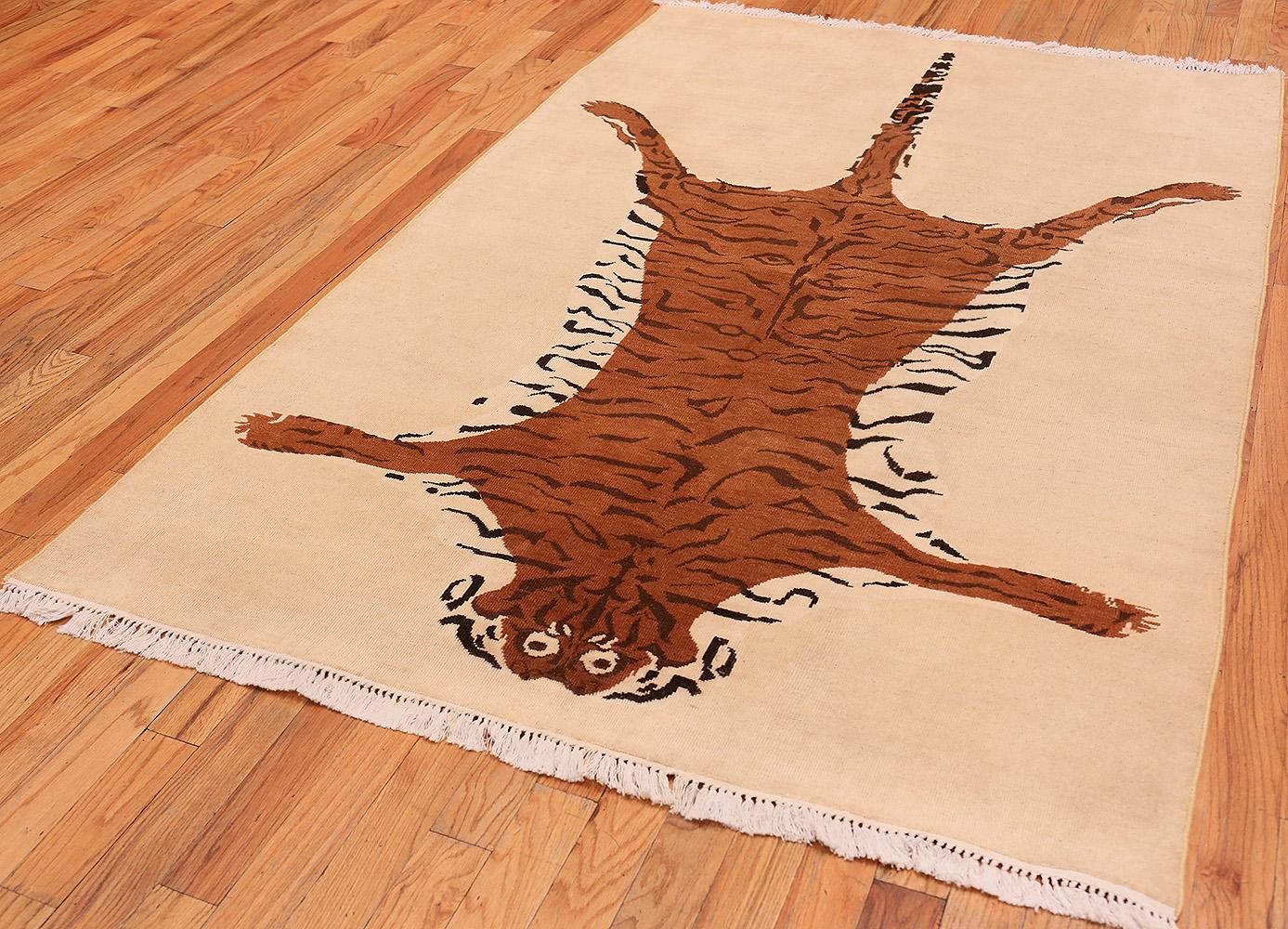 A beautiful and extremely artistic vintage tiger design rug, country of origin / rug type: Indian rugs, vintage, circa late 20th century. Size: 5 ft 4 in x 8 ft (1.63 m x 2.44 m)

This marvelous, highly unique vintage rug from the mid 20th century