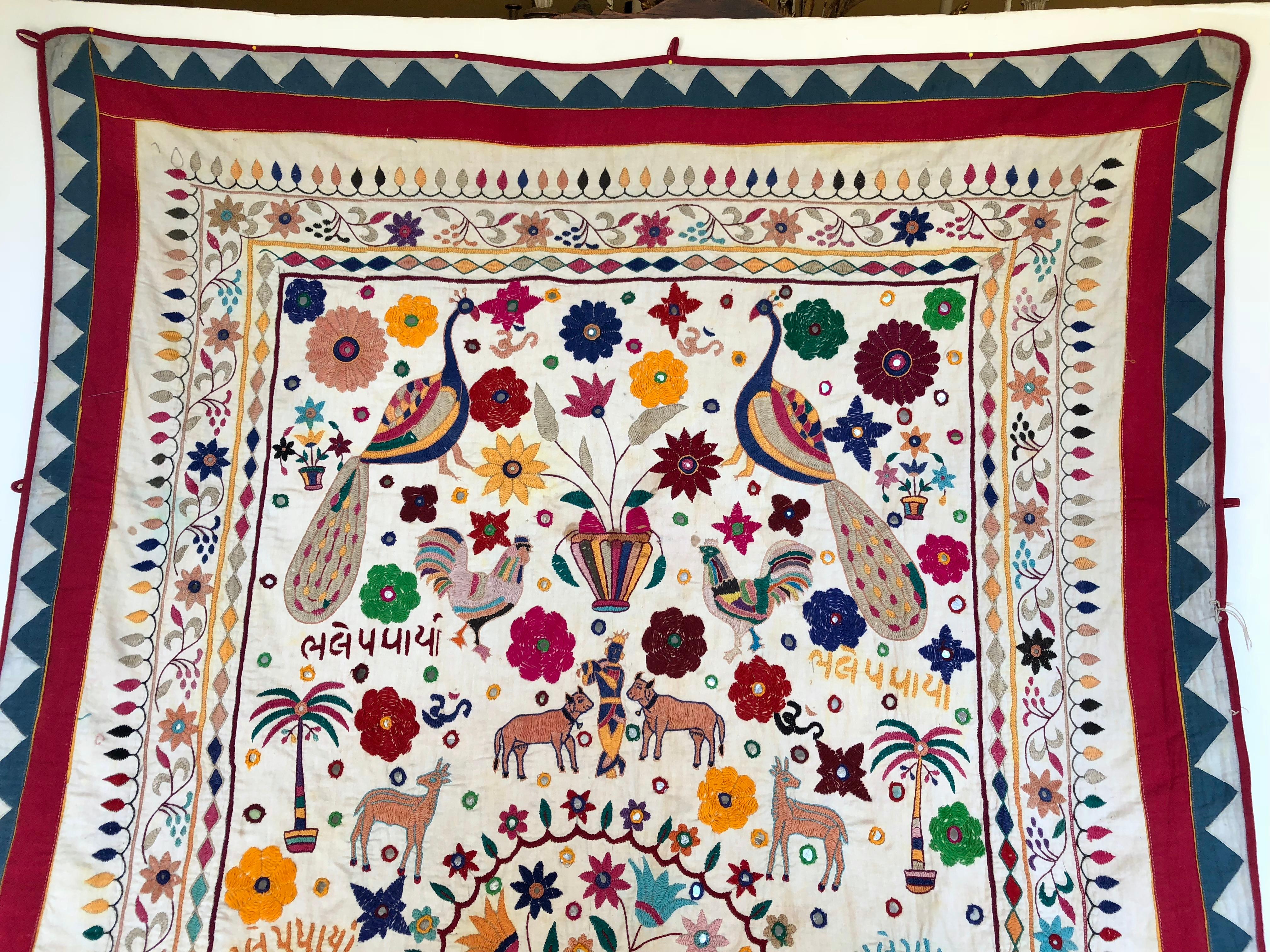 Vintage wedding canopy from India. The cotton base is hand embroidered with vibrant colored tribal designs and mirrors.
This piece was made for personal use, not the tourist trade, so it shows some wear but is still an outstanding example of Folk