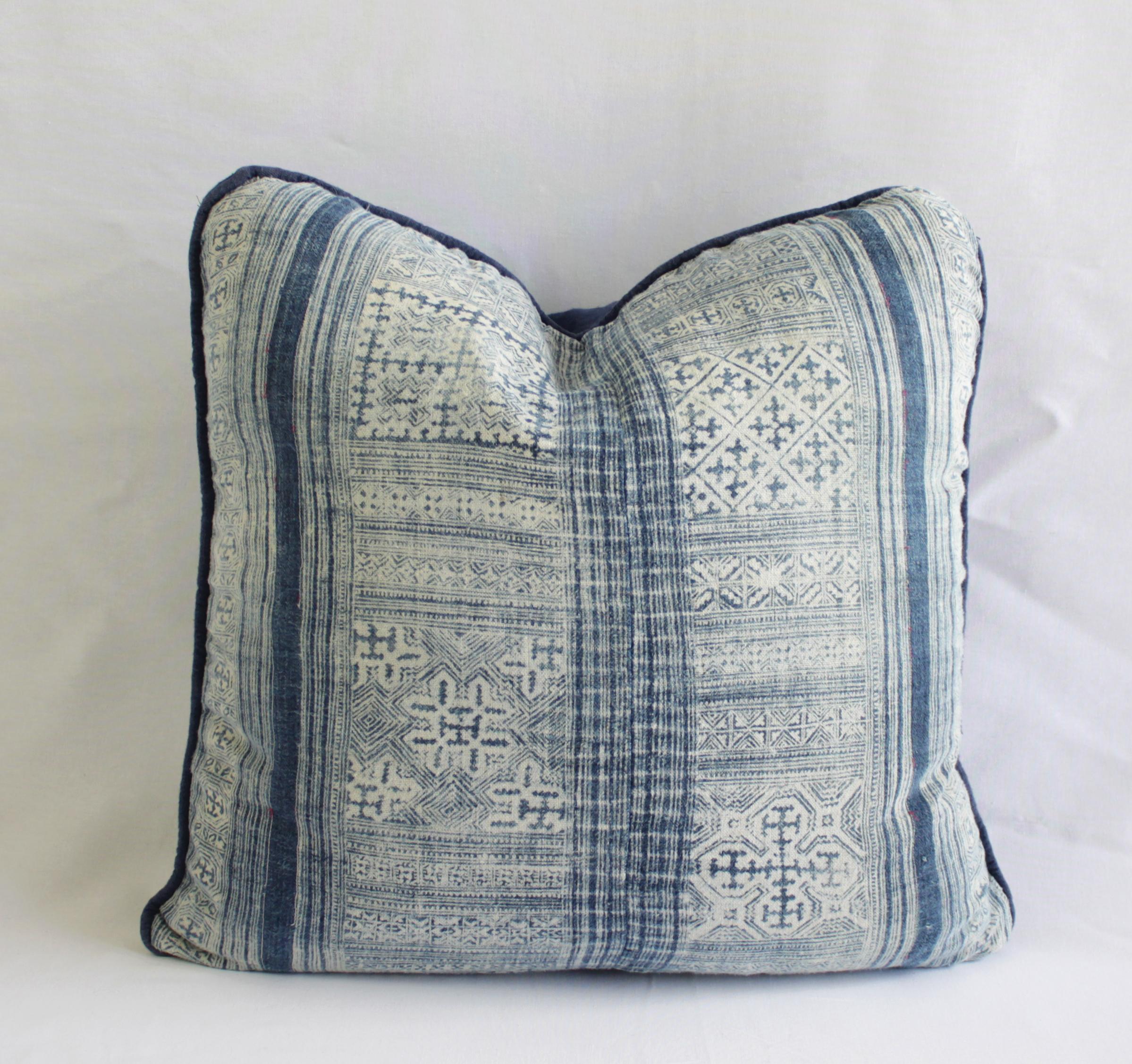 A beautiful indigo blue batik pattern, these pillows are custom made in our studios from vintage textiles. The front of the pillow are a beautiful pattern, with light and dark blue markings, on a nubby textural fabric. The back is a solid Belgian