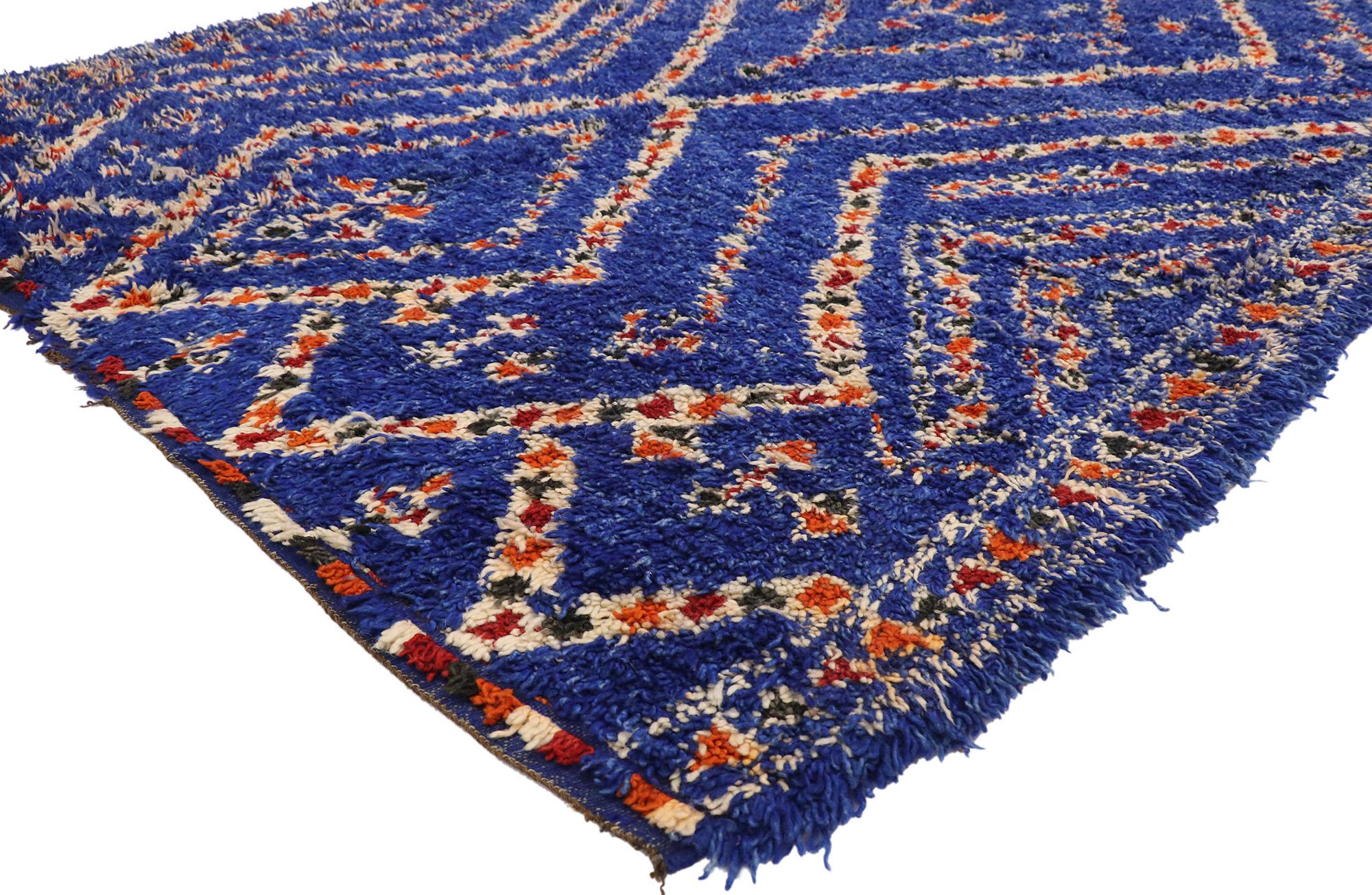 21016, vintage Indigo blue Beni M'Guild Moroccan rug with Modern Boho tribal style. This hand knotted wool vintage blue Beni M'Guild Moroccan rug features mirrored chevron lines united to form a vertical column of two lozenges with an open end