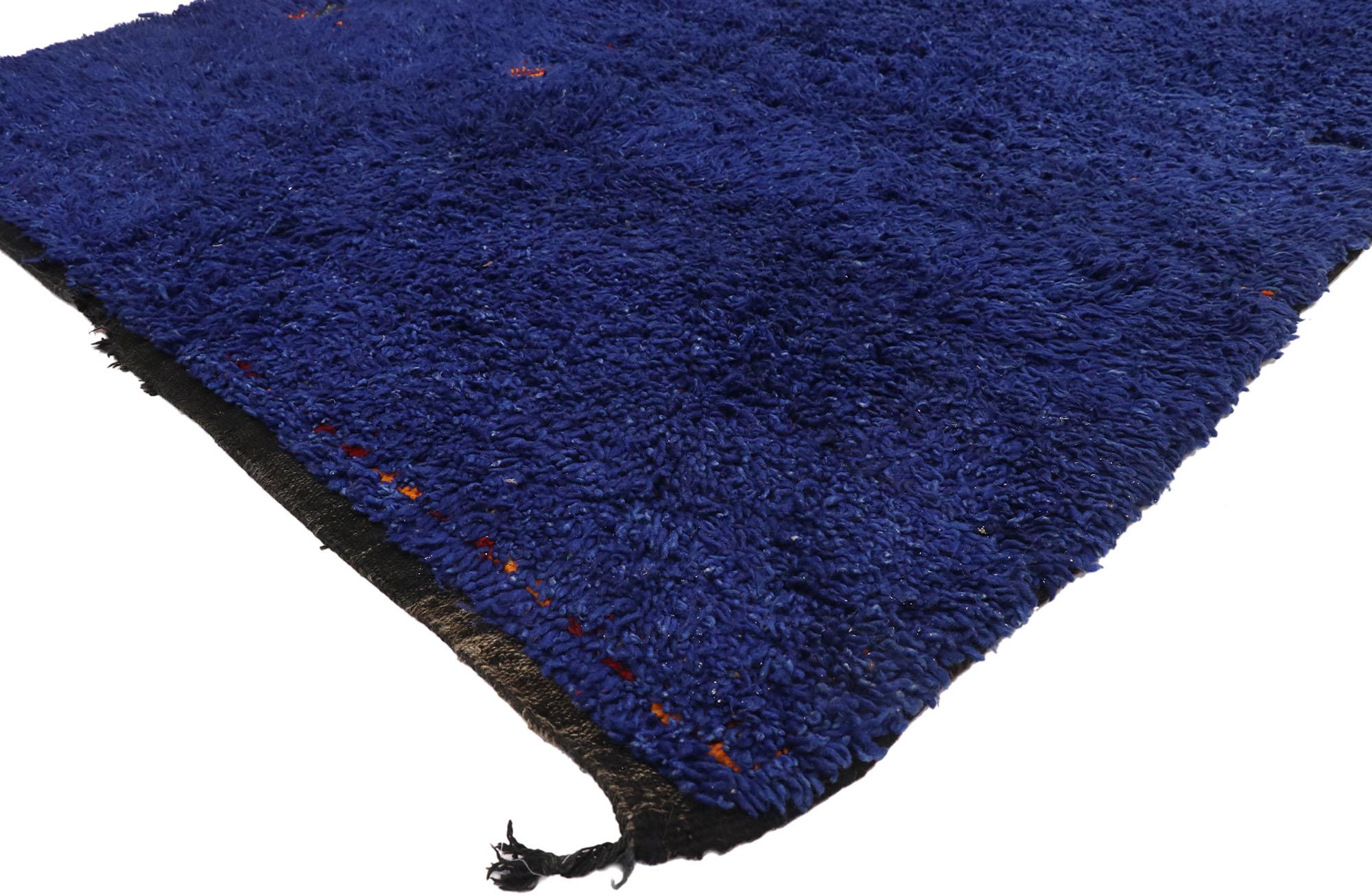 21058 VintageBlue Beni MGuild Moroccan Rug, 06'05 x 11'10. 
Embark on an enchanted journey, whisked away by the cozy embrace of this hand knotted wool vintage Beni MGuild Moroccan rug. This captivating blue Moroccan rug will take you on a magic