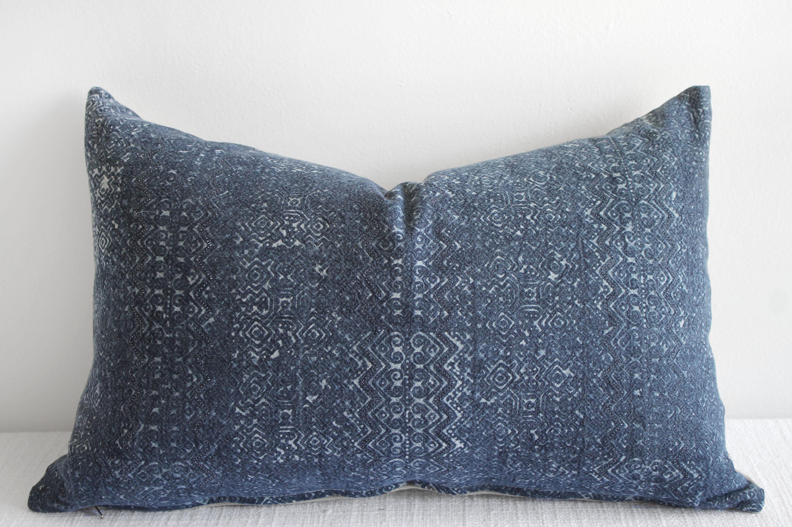 This woven indigo faded blue batik face features a tribal design, natural linen colored background. The backing is 100% Irish linen in natural linen. Our pillows are constructed with vintage one of a kind textiles from around the globe. Carefully