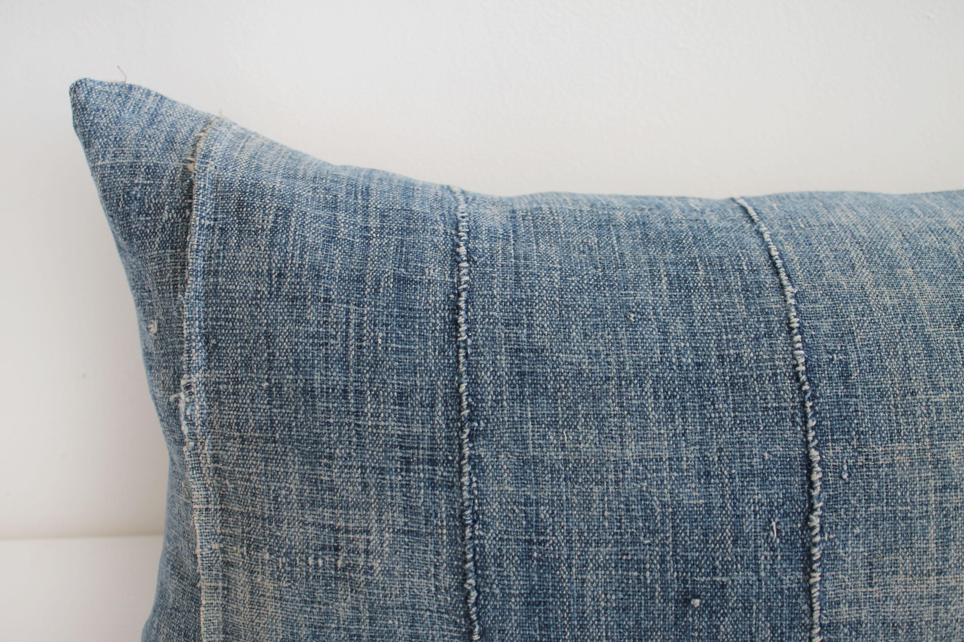Vintage Indigo mud cloth lumbar roll pillow
Made in our studio, from vintage cloth, this soft almost linen textured pillow has a beautiful faded denim look, but is soft to the hand. Original seams give this a charm and collected feel.
The backing