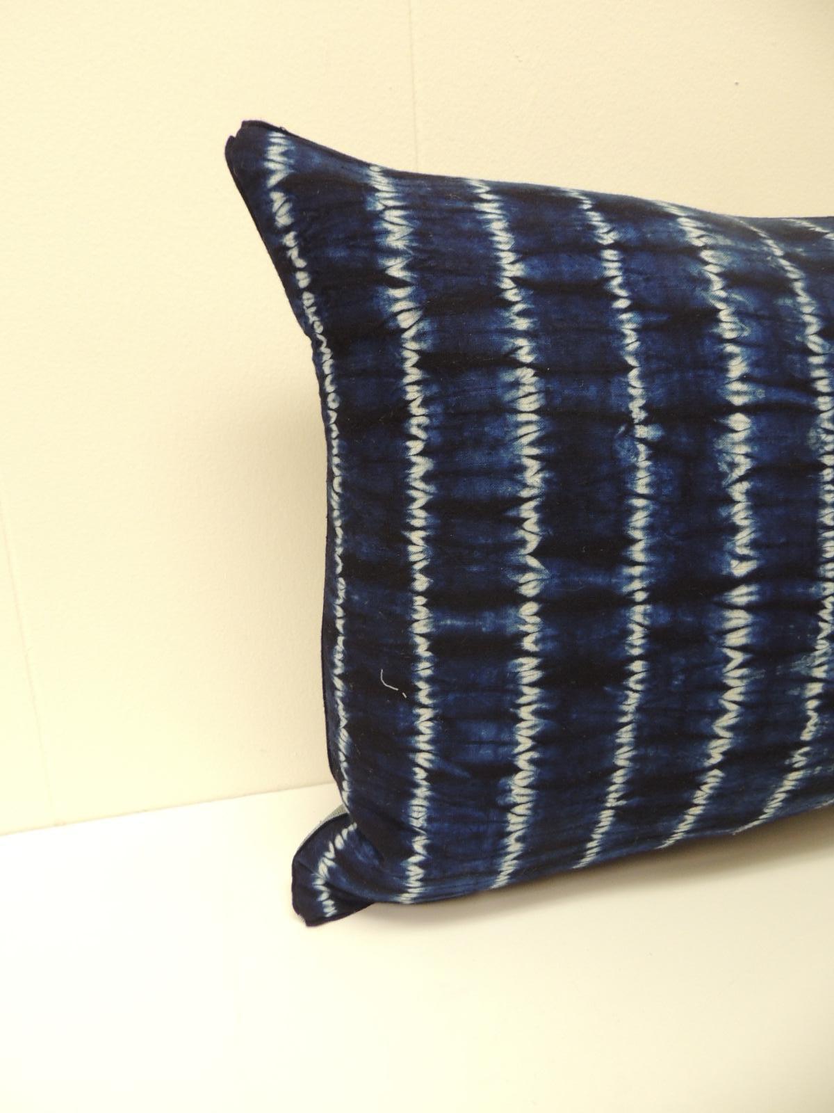 Vintage Indigo and White African Resist-Dyed Textile Decorative Pillow
Square pillow with textured silvery blue backing and small dark blue 
decorative trim all around made from the same vintage textile.
Decorative pillows handmade and designed in