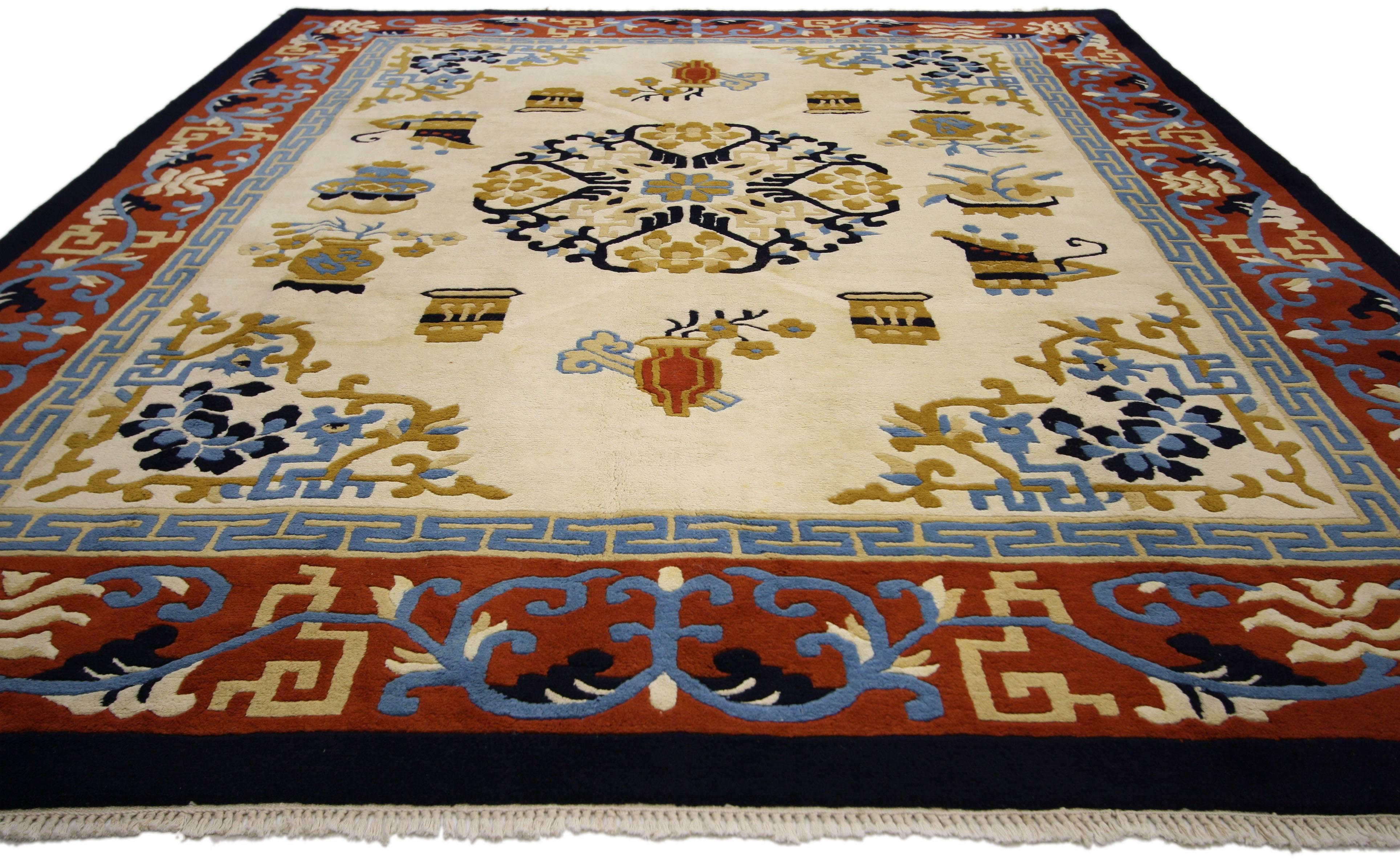 74745 Vintage Chinese Art Deco Style Rug 07'10 X 10'00.
This vintage Chinese Art Deco style rug was hand-knotted in India for the western market. Displaying a beige field with brick red border, this Chinese Art Deco style rug features a round floral