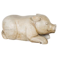 Vintage Indonesian Carved Reclining Pig Sculpture with Weathered Patina