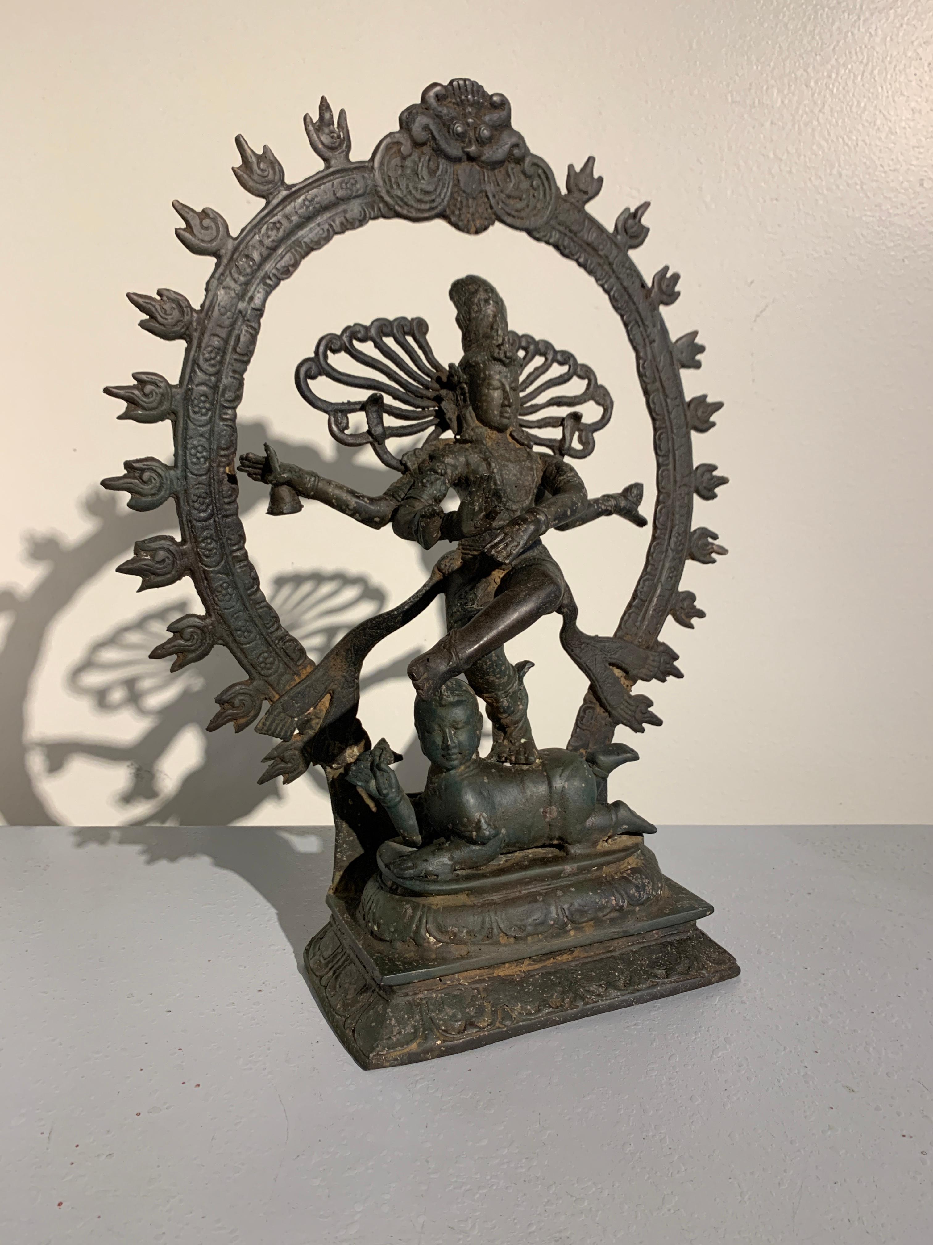A wonderfully animated Indonesian cast and patinated metal statue of Shiva Nataraja, Shiva as Lord of the Dace, Bali, 1970s.

The sculpture depicts one of the most famous images in Hindu mythology, that of Shiva dancing his cosmic dance, known as