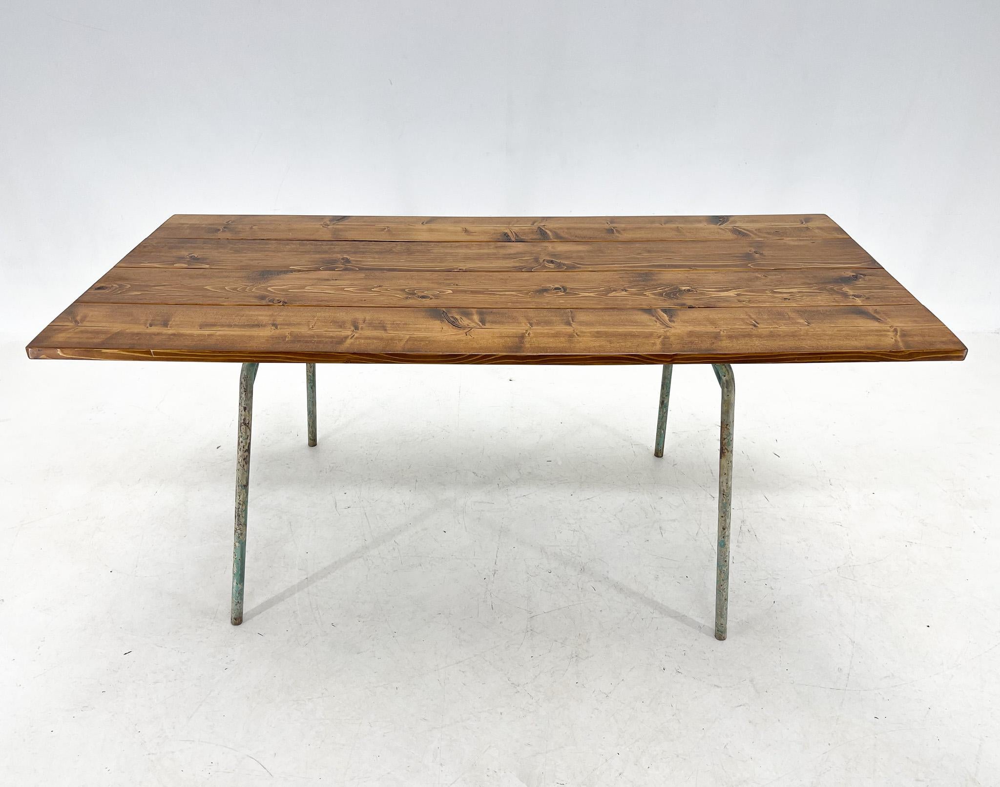 Beautifully time-patinated metal legs with a recycled wood top treated with special oil.