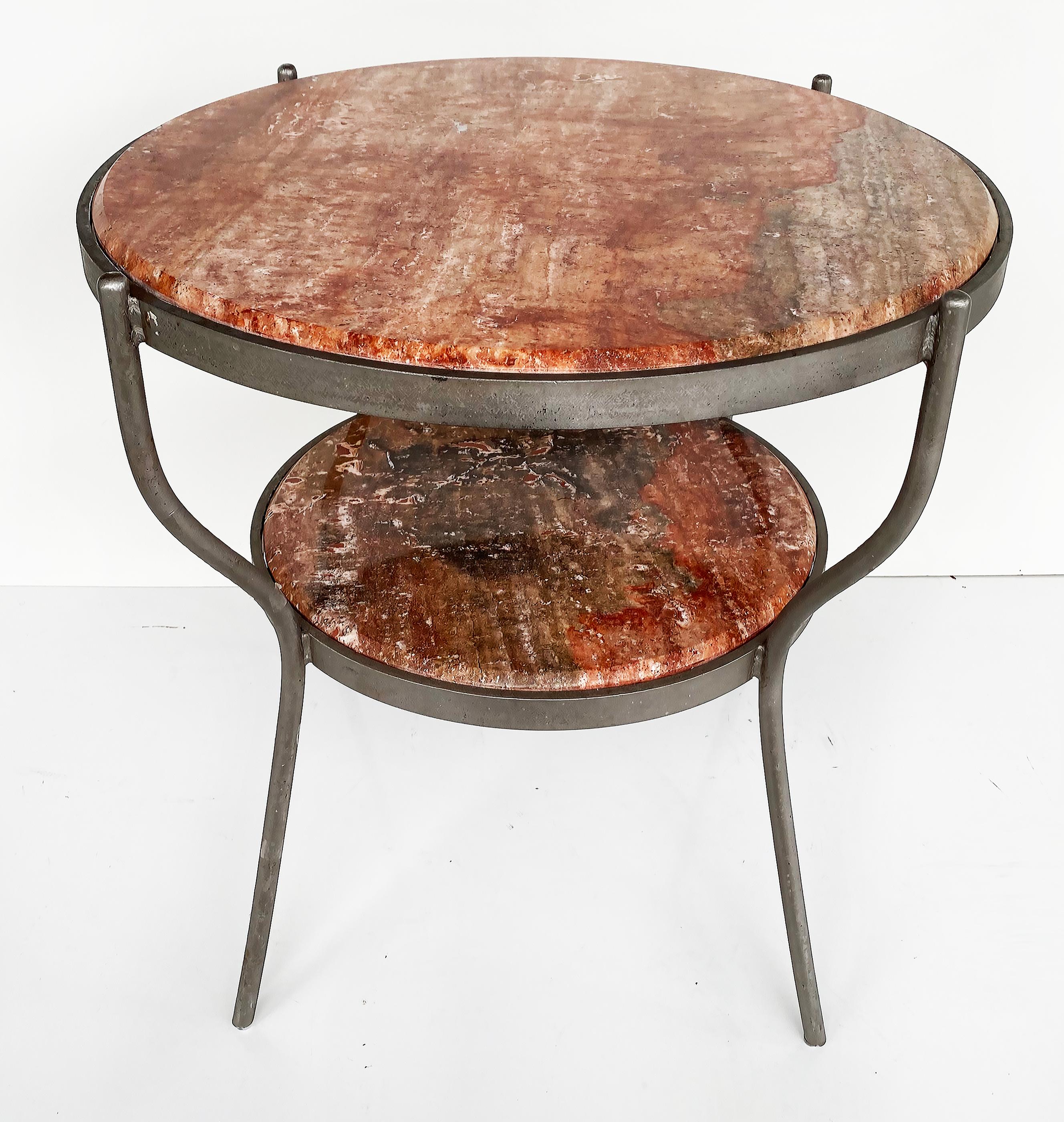 Vintage Industrial 2-Tier Metal Frame Marble Top Side Tables, Pair

Offered for sale is a pair of industrial-style two-tiered round marble side tables supported by metal frames. These vintage tables have round inset marble tops with shelves below.