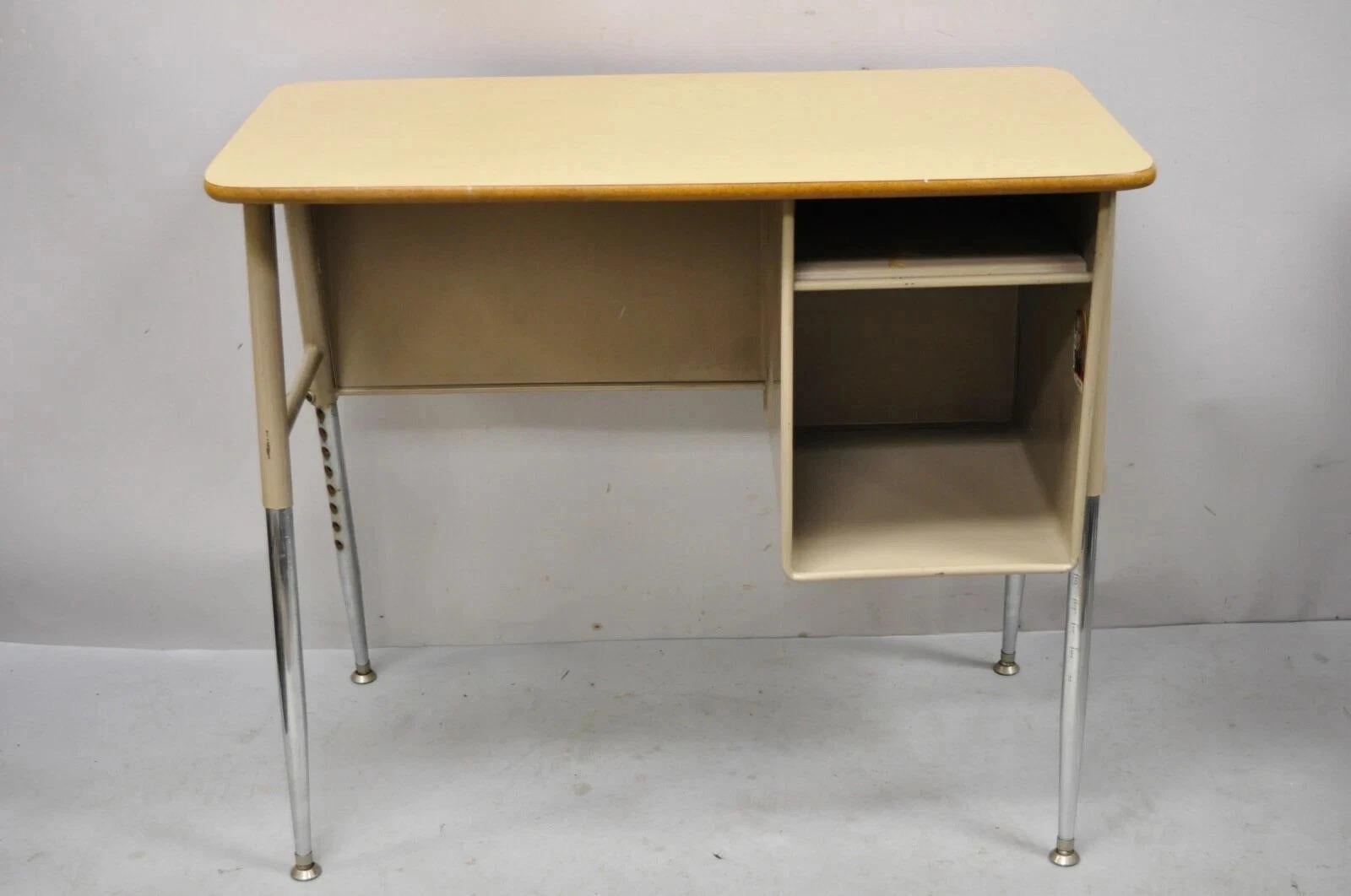 Please message us with your zip code to request a more reasonable domestic U.S. shipping quote.

Vintage Industrial Modern Adjustable Height Metal School Writing Desk With Laminate Top. Item features wood grain laminate top, adjustable height metal