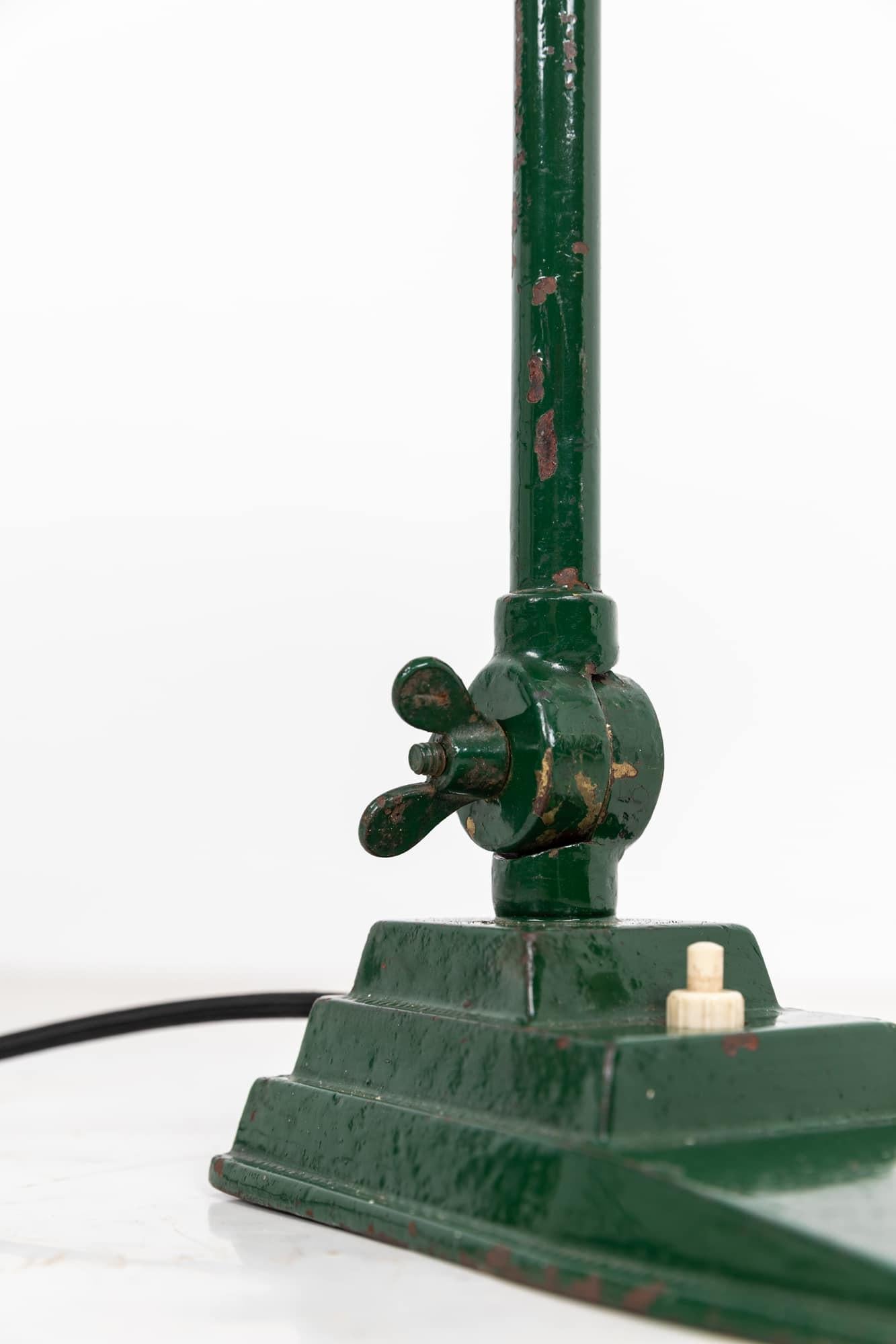 A simply formed green painted desk lamp made in Belgium by Astax. c.1950

Manufactured from steel with cast iron base and later painted in an industrial green. Manufactures mark to underside of base.

Rewired with 2m of black twist flex and BS 3-pin