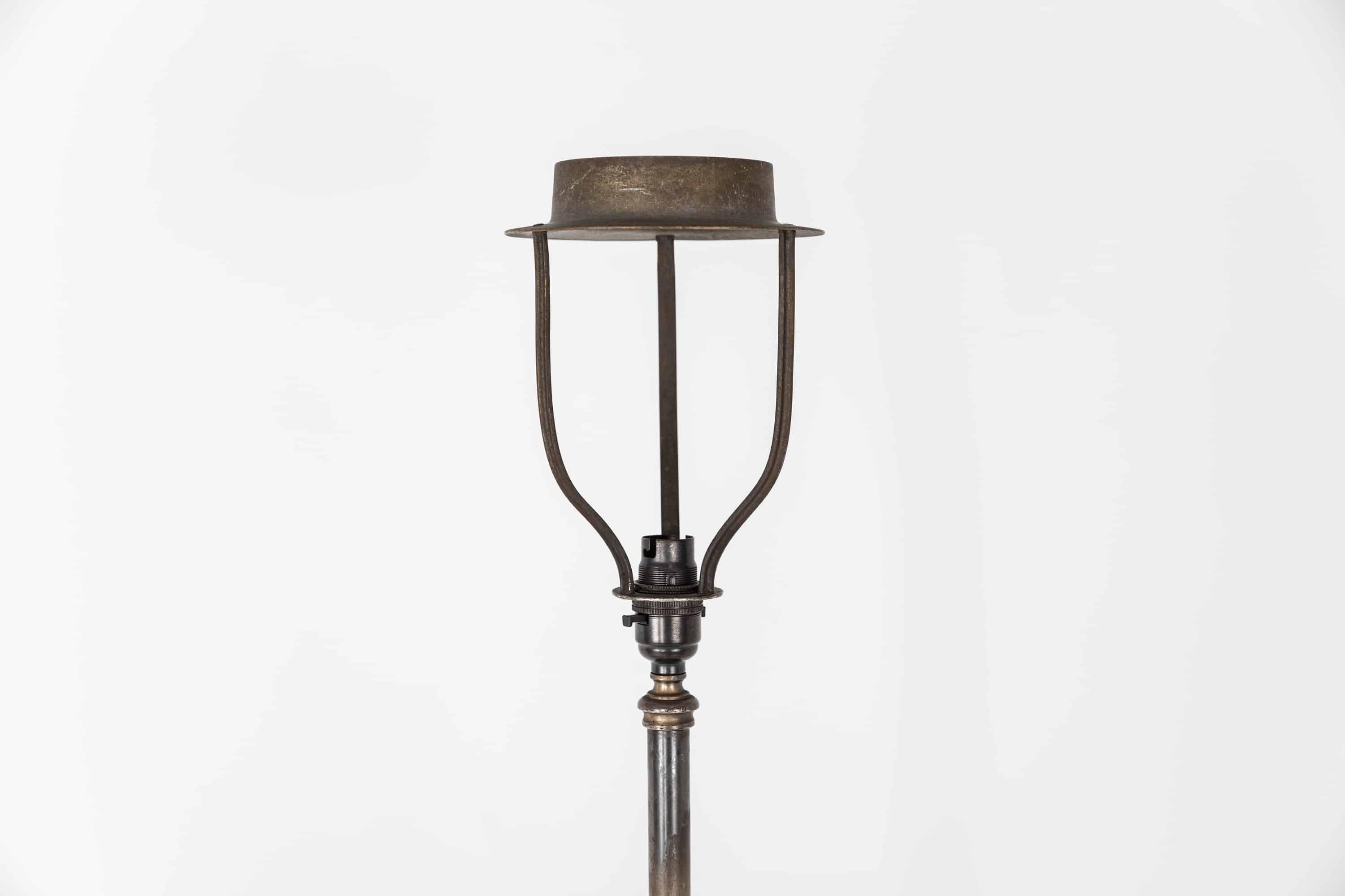 A large and very elegantly designed standard floor lamp made in England by GEC. circa 1920.

Made entirely of silver plated brass which has patinated perfectly. Original shade mount designed for vintage frilled shades, but a modern shade can be