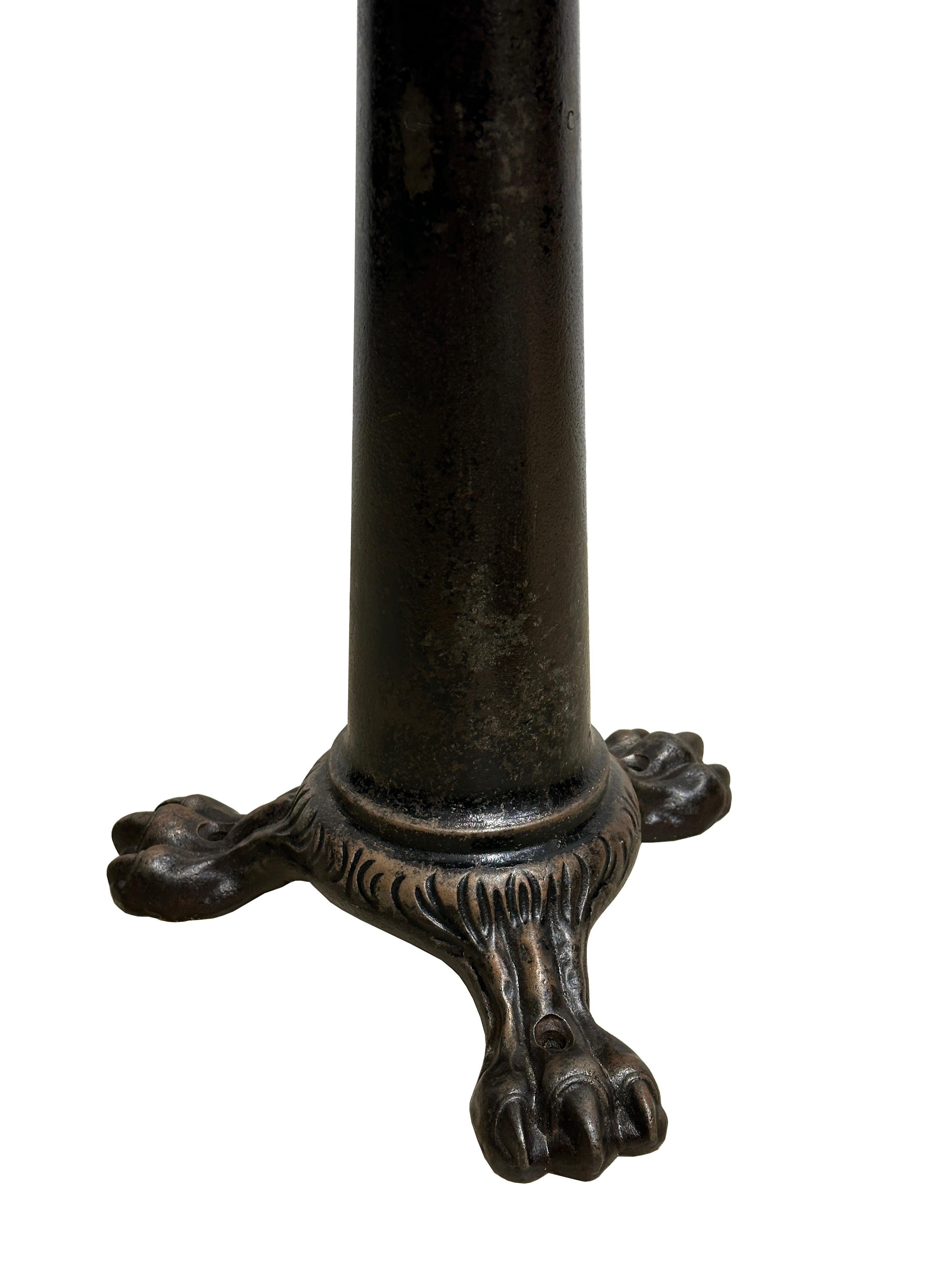 - A beautiful original and extremely rare first edition Singer work stool, England, late 19th Century.
- Cast iron base with signature claw foot design, reminiscent of the Victorian era.
- Seat is height adjustable and working perfectly, the top is