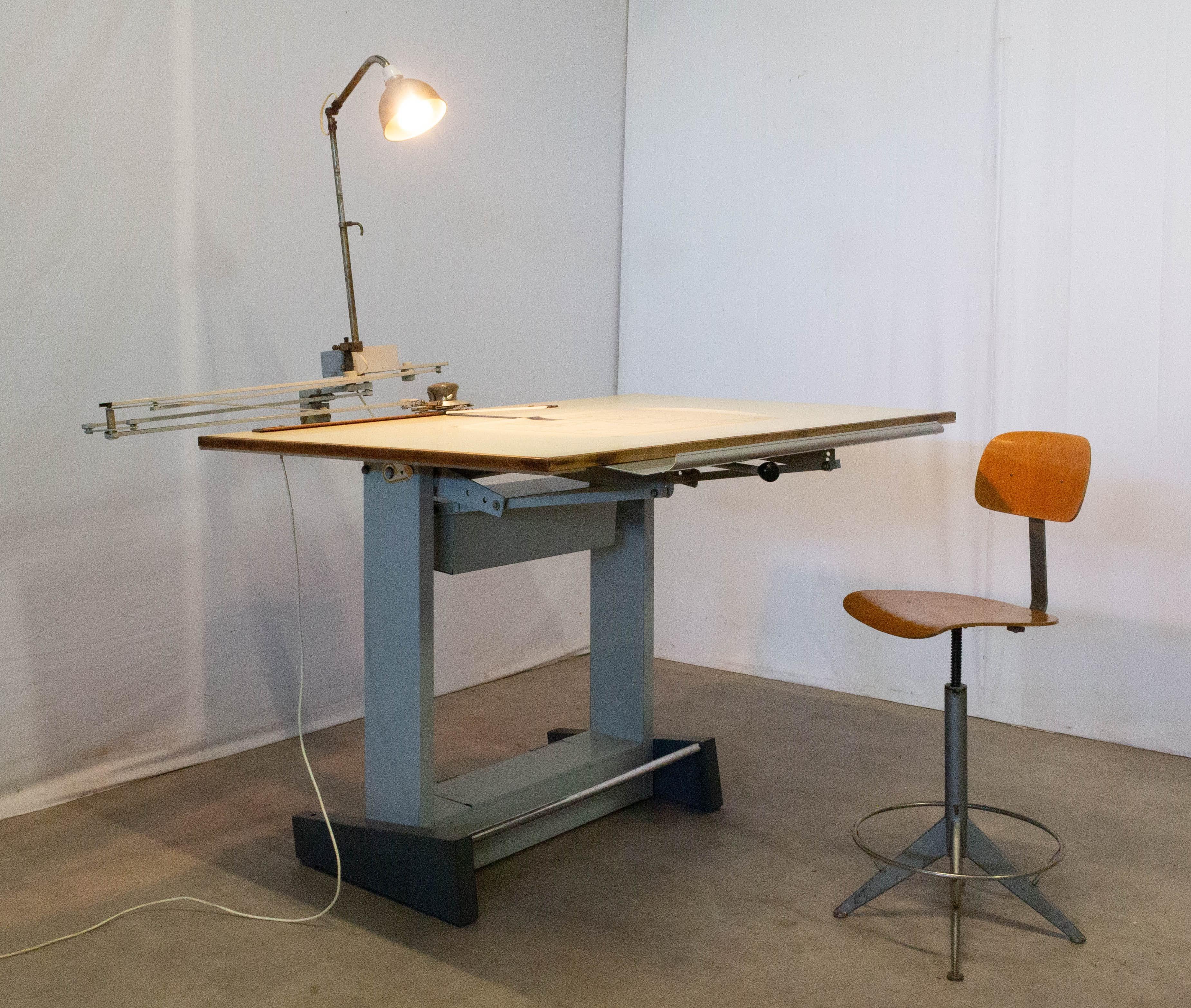 Complete Architch's drafting table midcentury
With all drawing accessories
Can be used as a kitchen island in an industrial loft
Height can be adjusted from 109 to 139 cm
Please see two midcentury industrial architect chairs Friso Kramer style