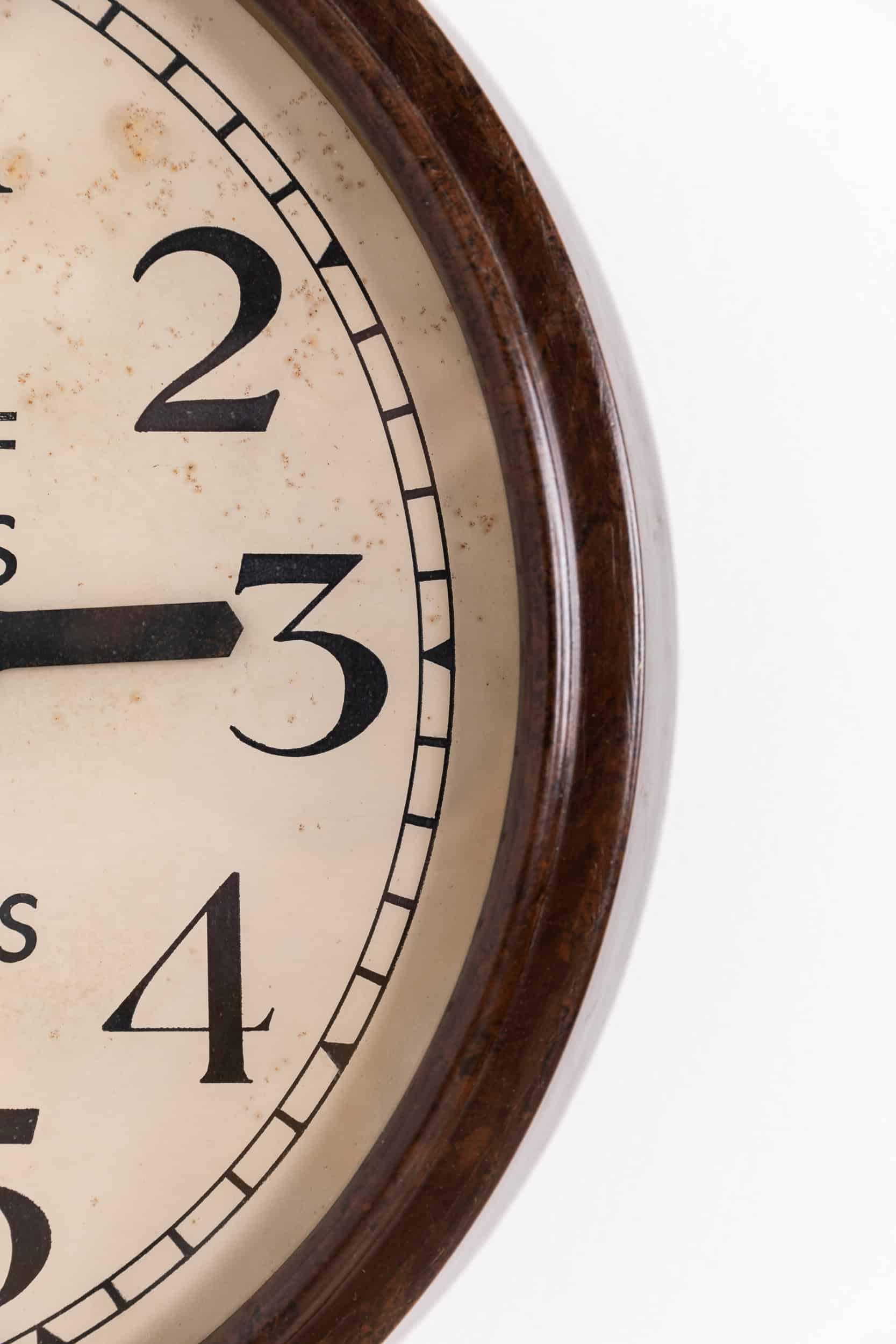

Stunning example of an industrial wall clock by Smiths English Clock Systems. c.1940

A fully original Smiths dial, set in a beautiful marbled Bakelite surround. Original memorial text to the dial reading 