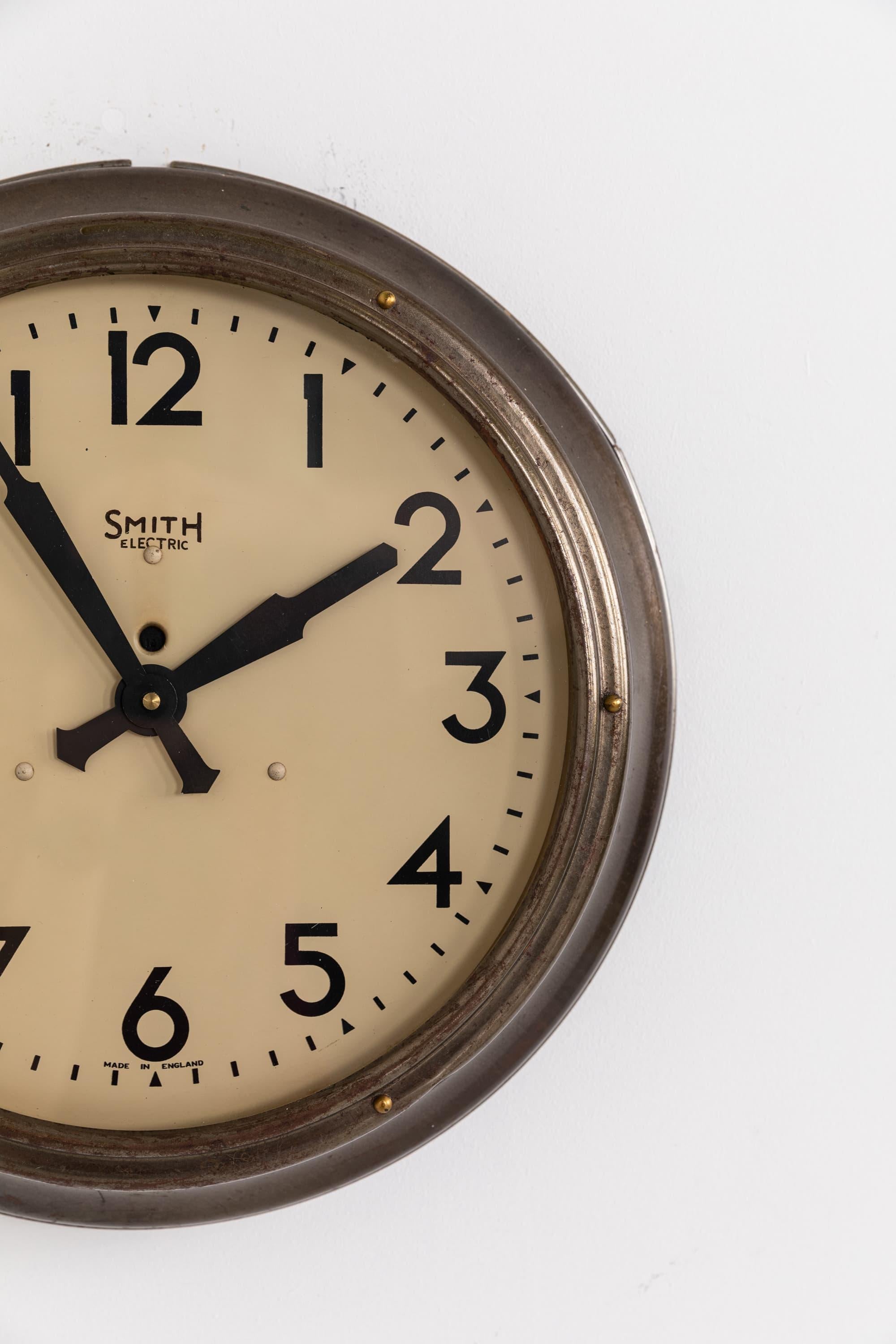 A very nice example of the iconic industrial wall clock by Smiths English Clock Systems. circa 1930

Surviving in amazing condition, this clock pre-dates the 1937 switch over to the Sectric branding. The 12