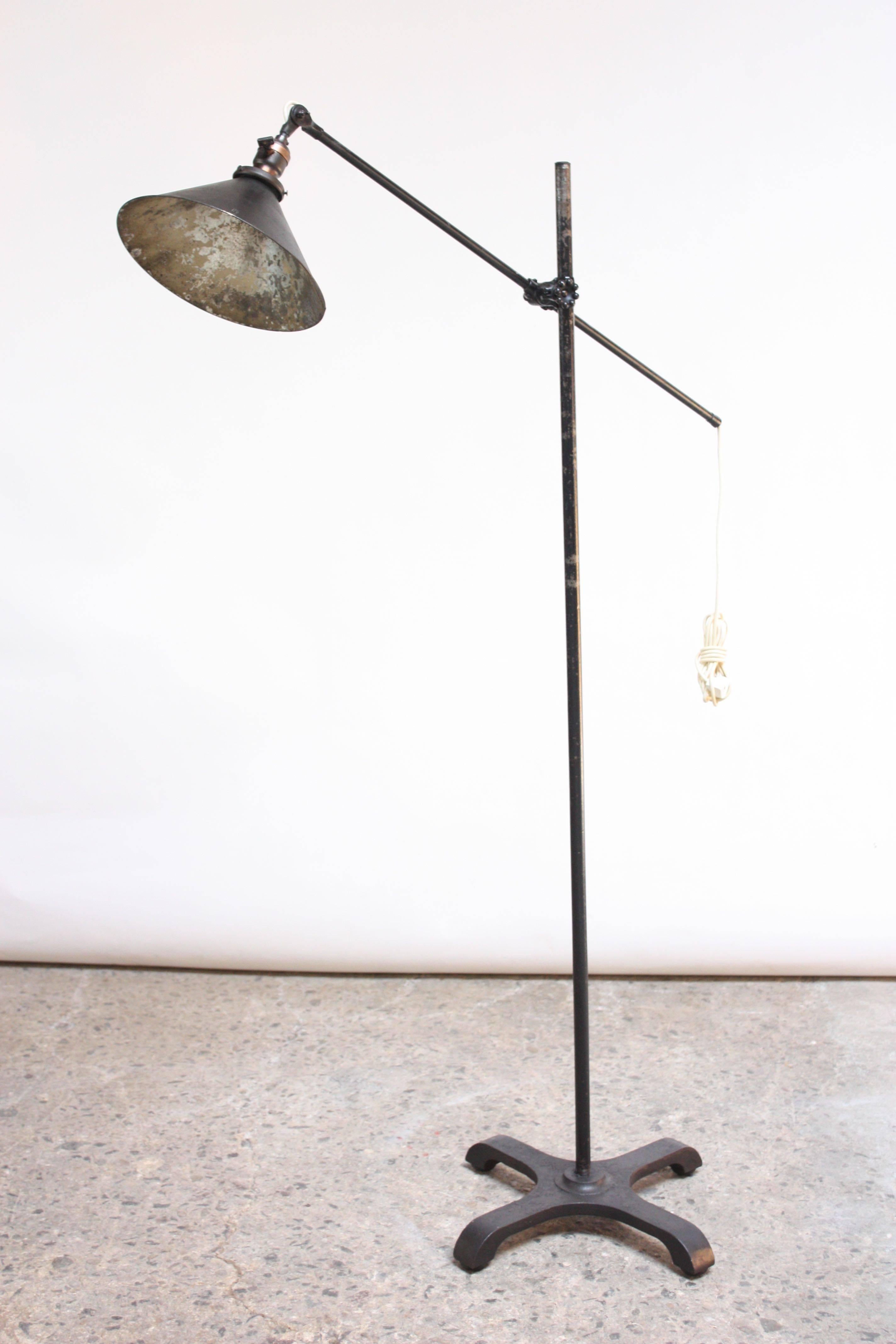 O.C. White (circa 1930s) floor lamp complete with all original parts (knobbed knuckle adjuster, socket, screws). Composed of a steel arm, stem, and base with a painted tin shade. Arm and shade are adjustable.
Original condition with only minor