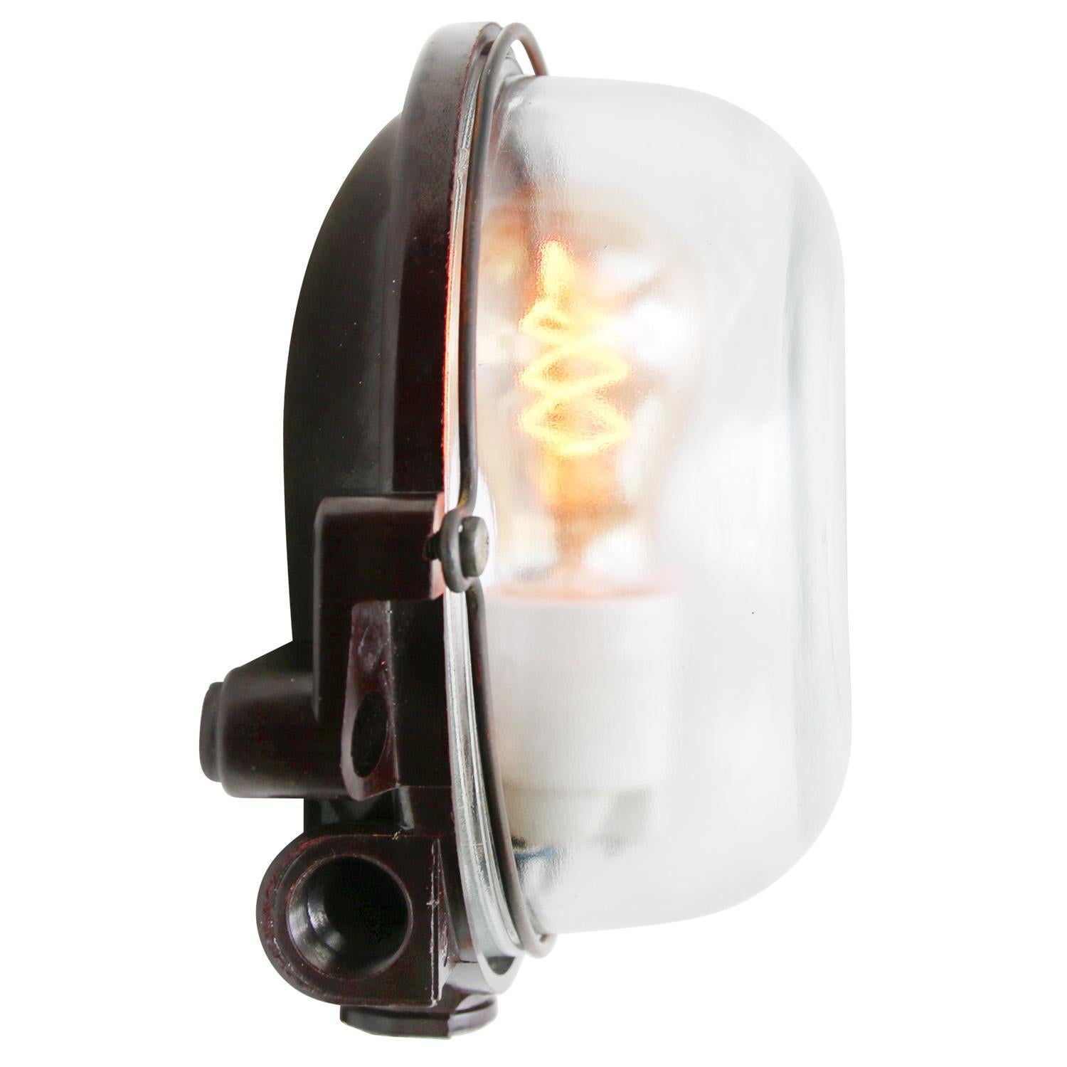 Industrial wall and ceiling scone. Bakelite back. Clear glass.

Weight 1.0 kg / 2.2 lb

Priced per individual item. All lamps have been made suitable by international standards for incandescent light bulbs, energy-efficient and LED bulbs. The