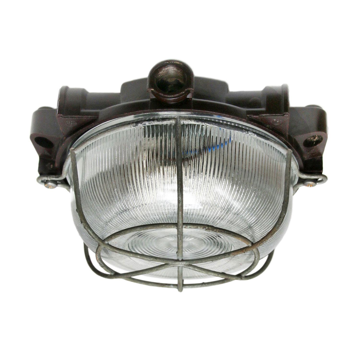 Industrial wall and ceiling scone. Bakelite back. Holophane striped glass.
Metal frame.

Measure: Weight 1.0 kg / 2.2 lb

Priced individual item. All lamps have been made suitable by international standards for incandescent light bulbs,