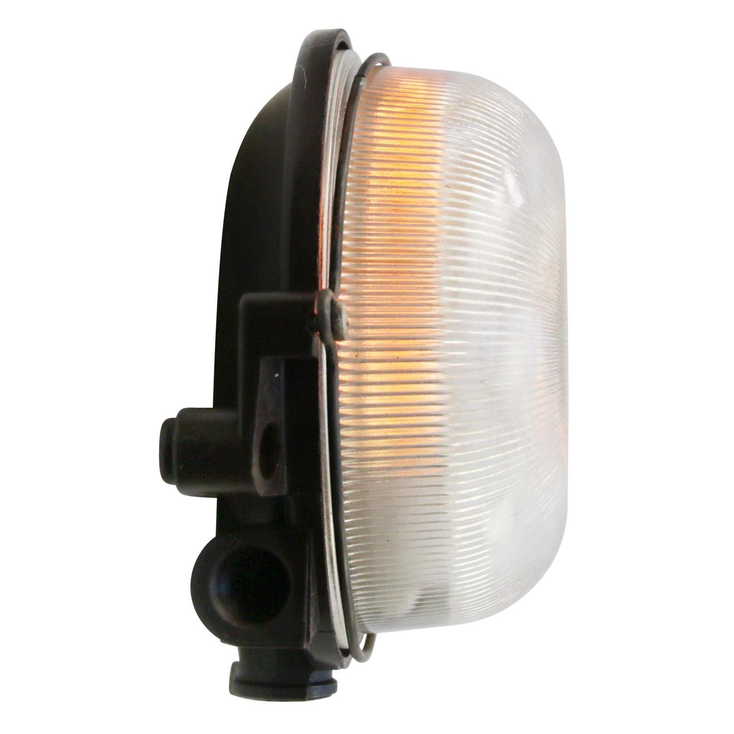 Industrial wall and ceiling scone. Bakelite back. Holophane striped glass.

Weight 1.0 kg / 2.2 lb

Priced per individual item. All lamps have been made suitable by international standards for incandescent light bulbs, energy-efficient and LED
