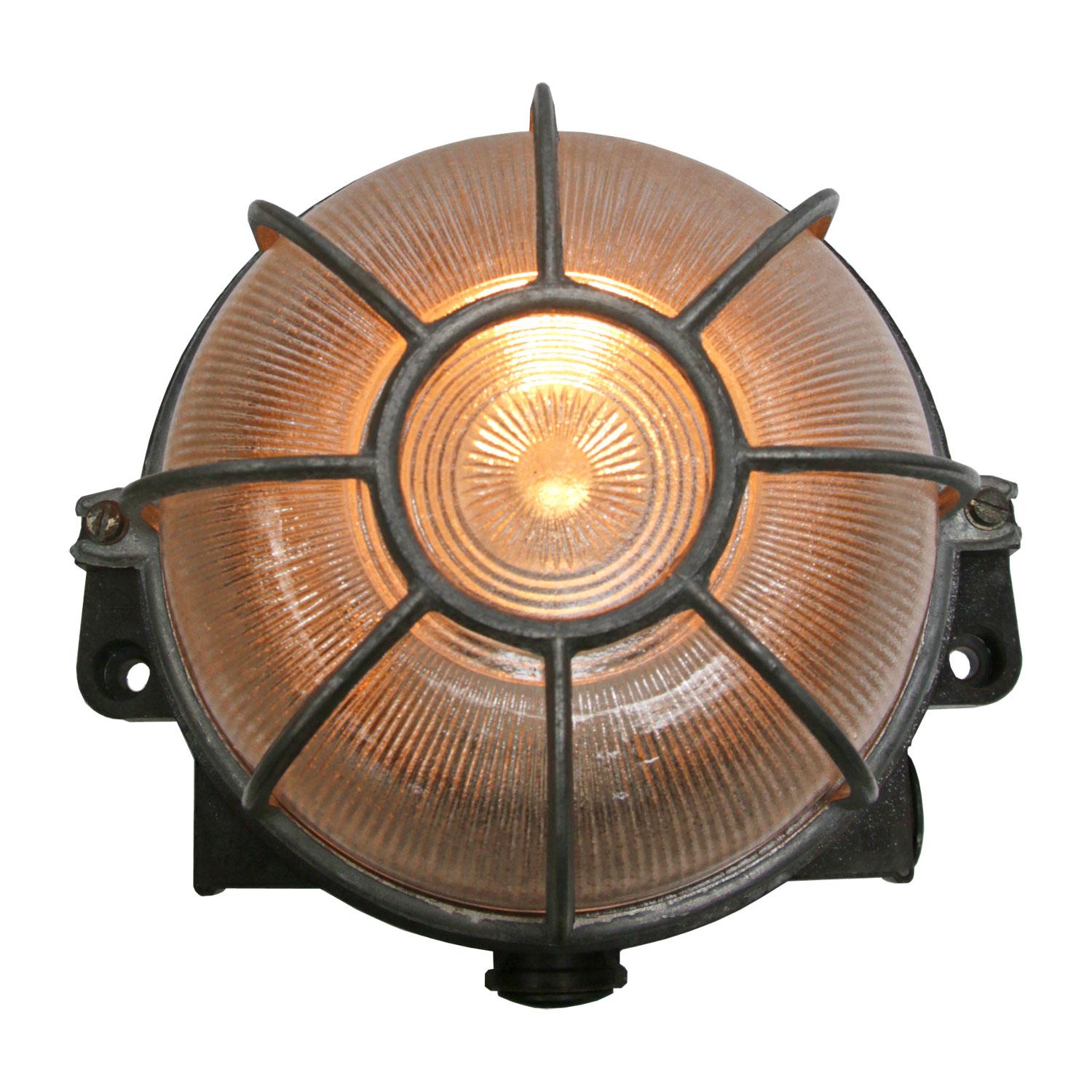 Industrial sconce, wall lamp.
Bakelite back, clear glass
Aluminium cage

Weight 1.0 kg / 2.2 lb

Priced per individual item. All lamps have been made suitable by international standards for incandescent light bulbs, energy-efficient and LED bulbs.