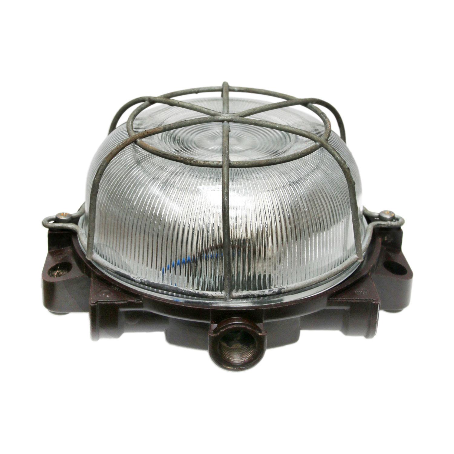 Industrial wall and ceiling scone. Bakelite back. Holophane striped glass.
Metal frame.

Measure: Weight 1.0 kg / 2.2 lb

Priced individual item. All lamps have been made suitable by international standards for incandescent light bulbs,