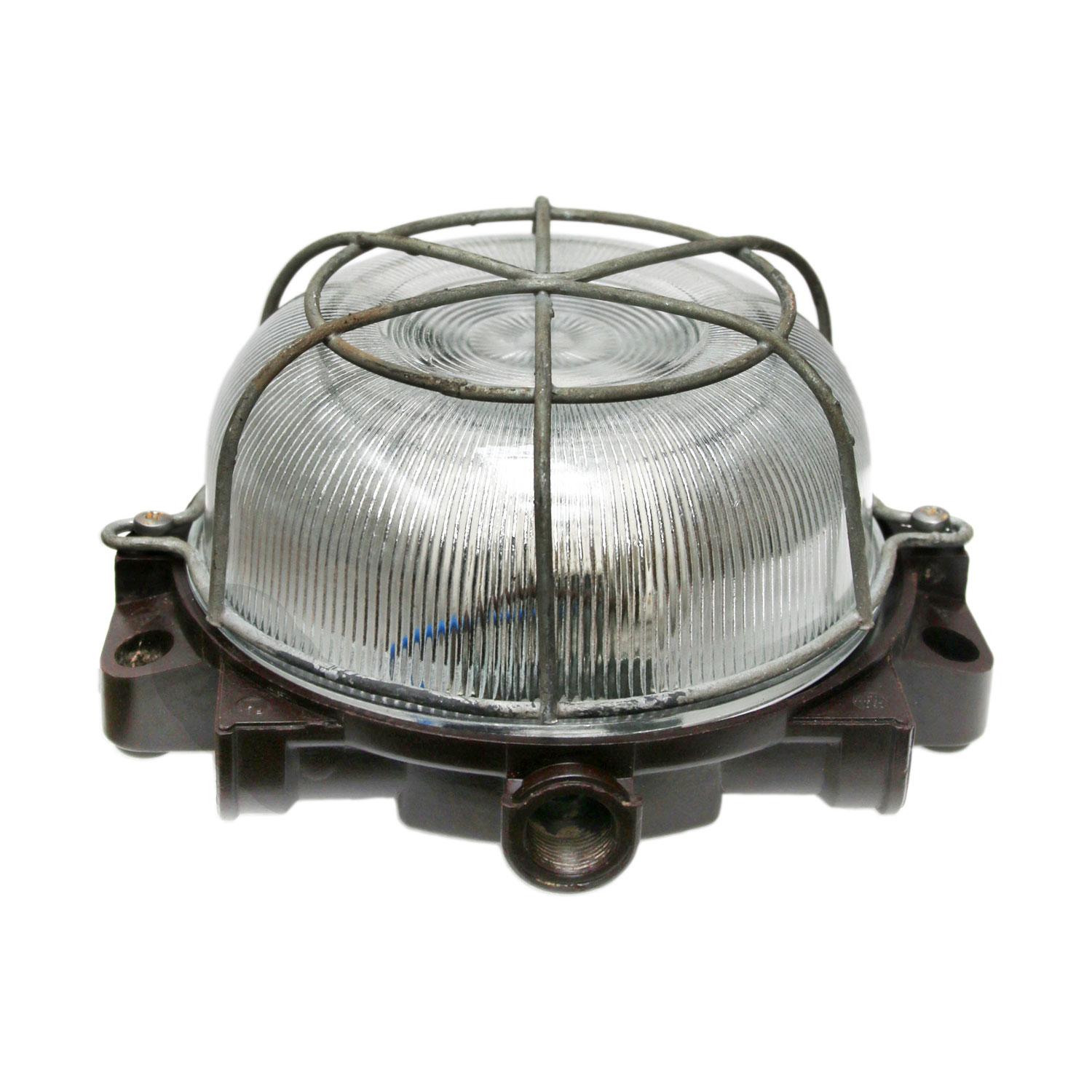 Industrial wall and ceiling Sconce. Bakelite back. 
Striped glass. Metal frame.

Measure: Weight 1.0 kg / 2.2 lb

Priced individual item. All lamps have been made suitable by international standards for incandescent light bulbs, energy-efficient and