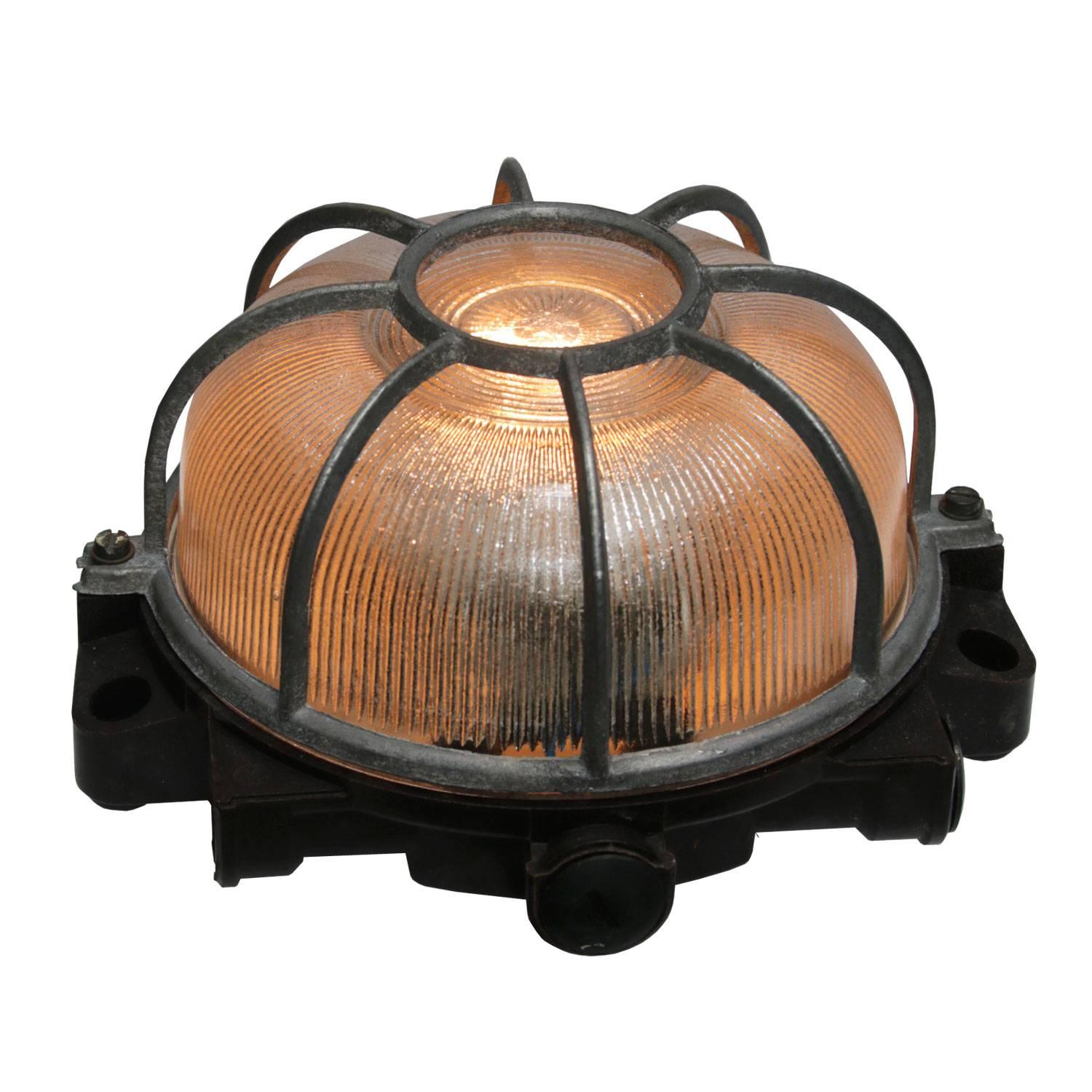 Industrial wall and ceiling scone. Bakelite back. Holophane striped glass.
Aluminium frame.

Weight 1.0 kg / 2.2 lb

Priced individual item. All lamps have been made suitable by international standards for incandescent light bulbs,