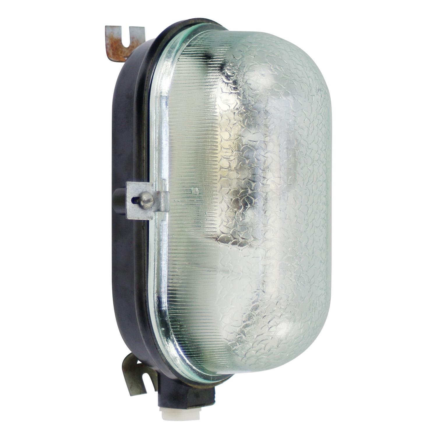 Industrial wall or ceiling lamp
Black Bakelite, clear structured glass

Weight: 0.70 kg / 1.5 lb

Priced per individual item. All lamps have been made suitable by international standards for incandescent light bulbs, energy-efficient and LED bulbs.