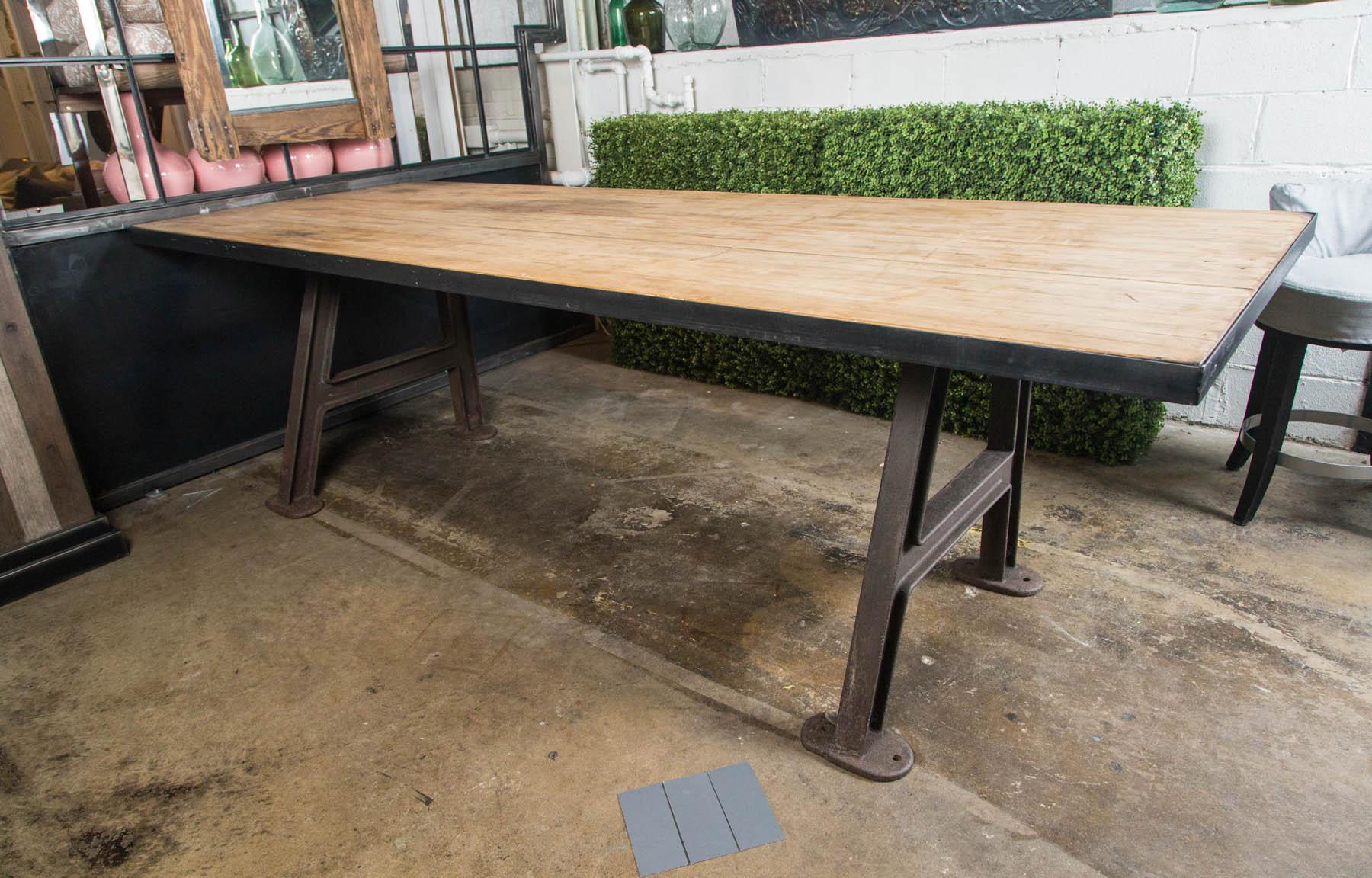 Counter height industrial base with reclaimed wood top.