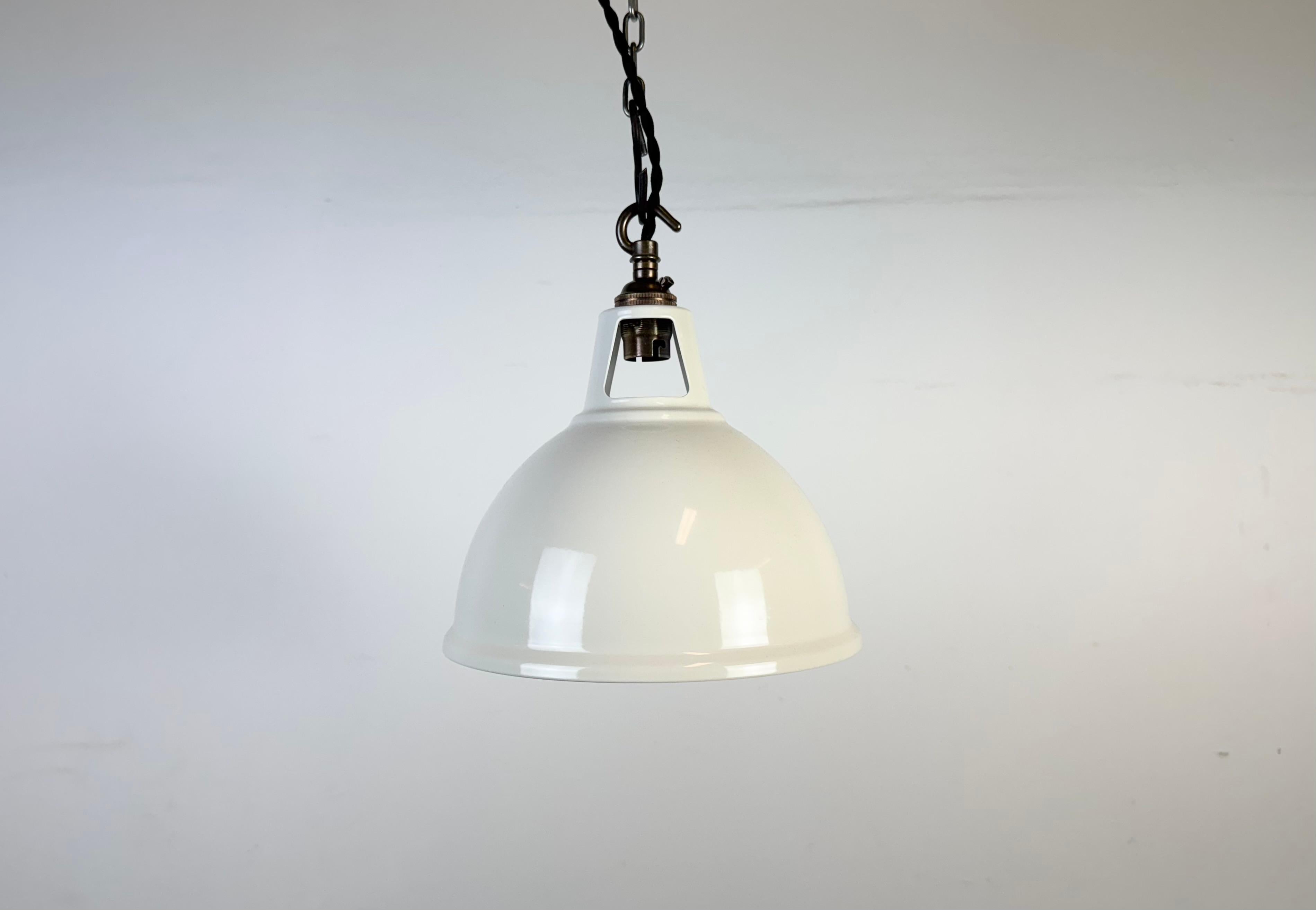 Vintage beige painted pendant light in industrial style made in United Kingdom between 2000-2010. White painted inside the shade. Brass top. The socket requires  B22 light bulbs. New wire. The weight of the lamp is 0,3 kg.The diameter of the lamp is