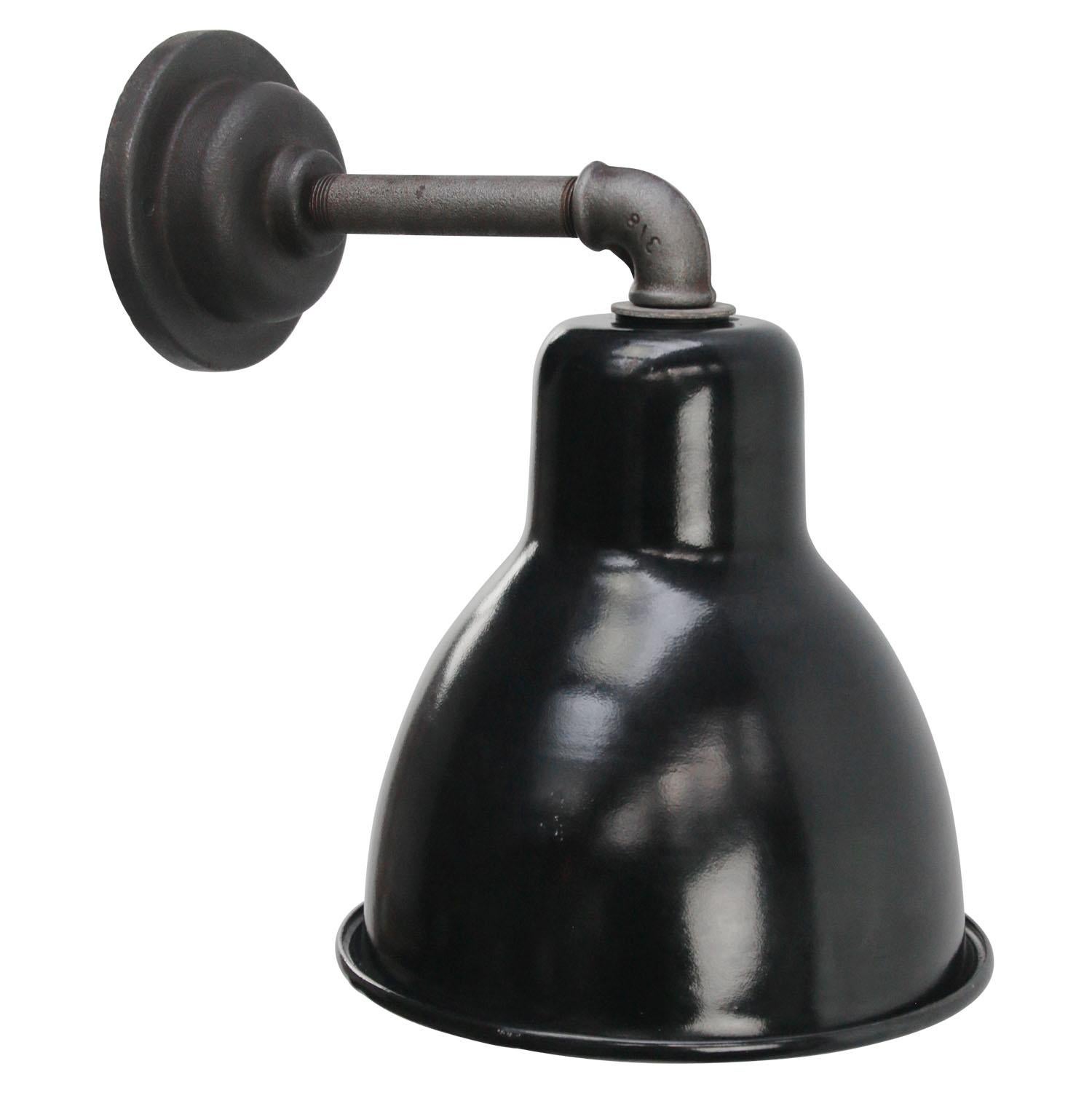 Factory wall light.
Black enamel shade, cast iron arm and wall plate

diameter cast iron wall piece: 10.5 cm / 4” - 2 holes to secure

Weight: 1.60 kg / 3.5 lb

Priced per individual item. All lamps have been made suitable by international standards