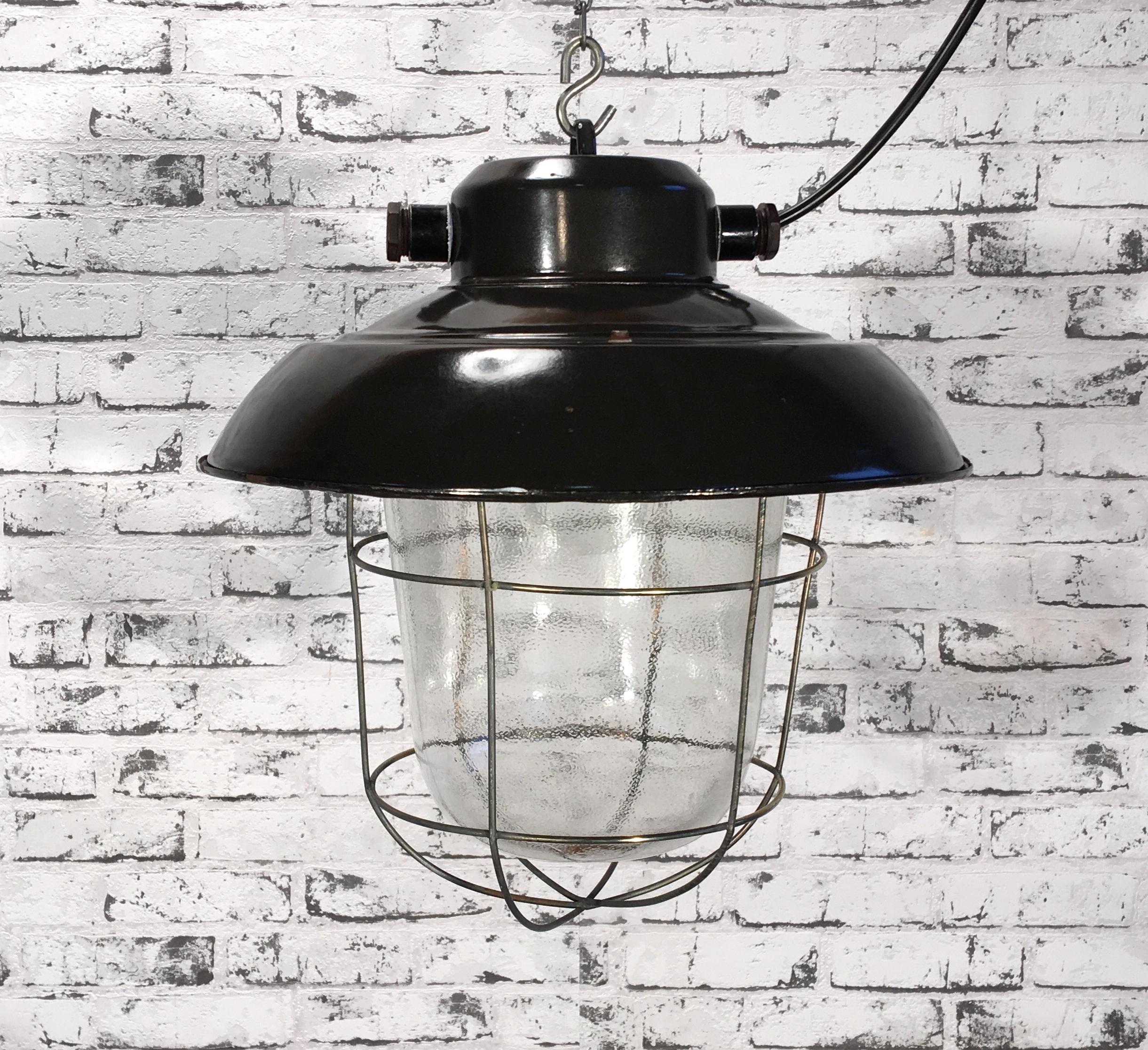 - Vintage Industrial lamp from former Czechoslovakia made during the 1960s
- Black enamel shade with white interior
- Frosted glass, Iron grid
- New porcelain socket for E 27 lightbulbs and wire, Weight: 4 kg
- Fully functional.