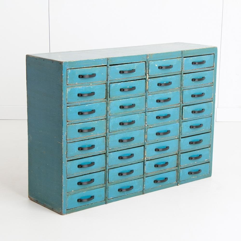 A vintage industrial bank of 32 drawers from an old ironmongery shop.
