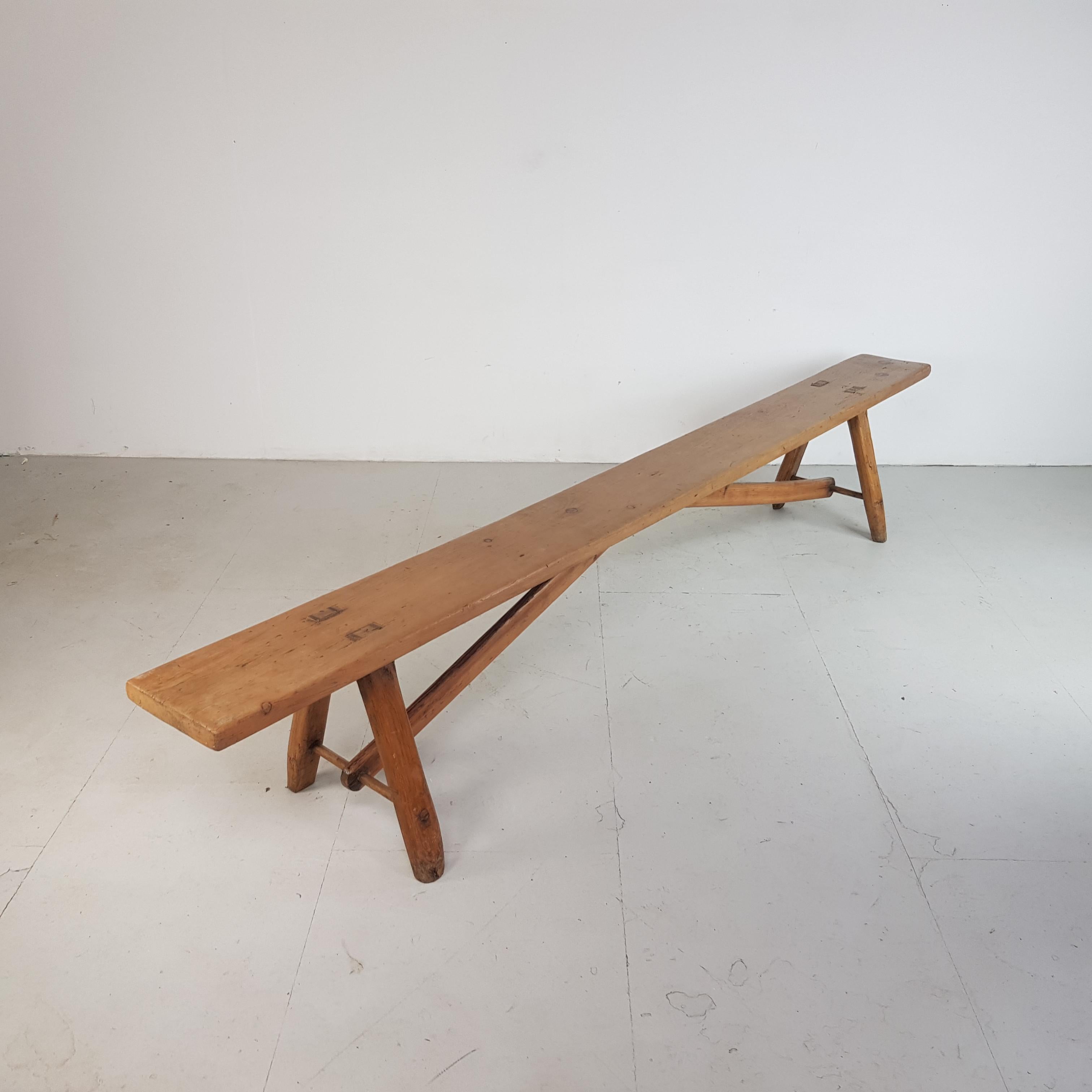 Really lovely 19th century primitive fruitwood bench. Very long rectangular seat raised on staked legs and diagonal stretchers.

Approximate dimensions:

Width: 306cm

Height: 50cm

Depth: 46cm

Seat depth: 28cm

A great piece of