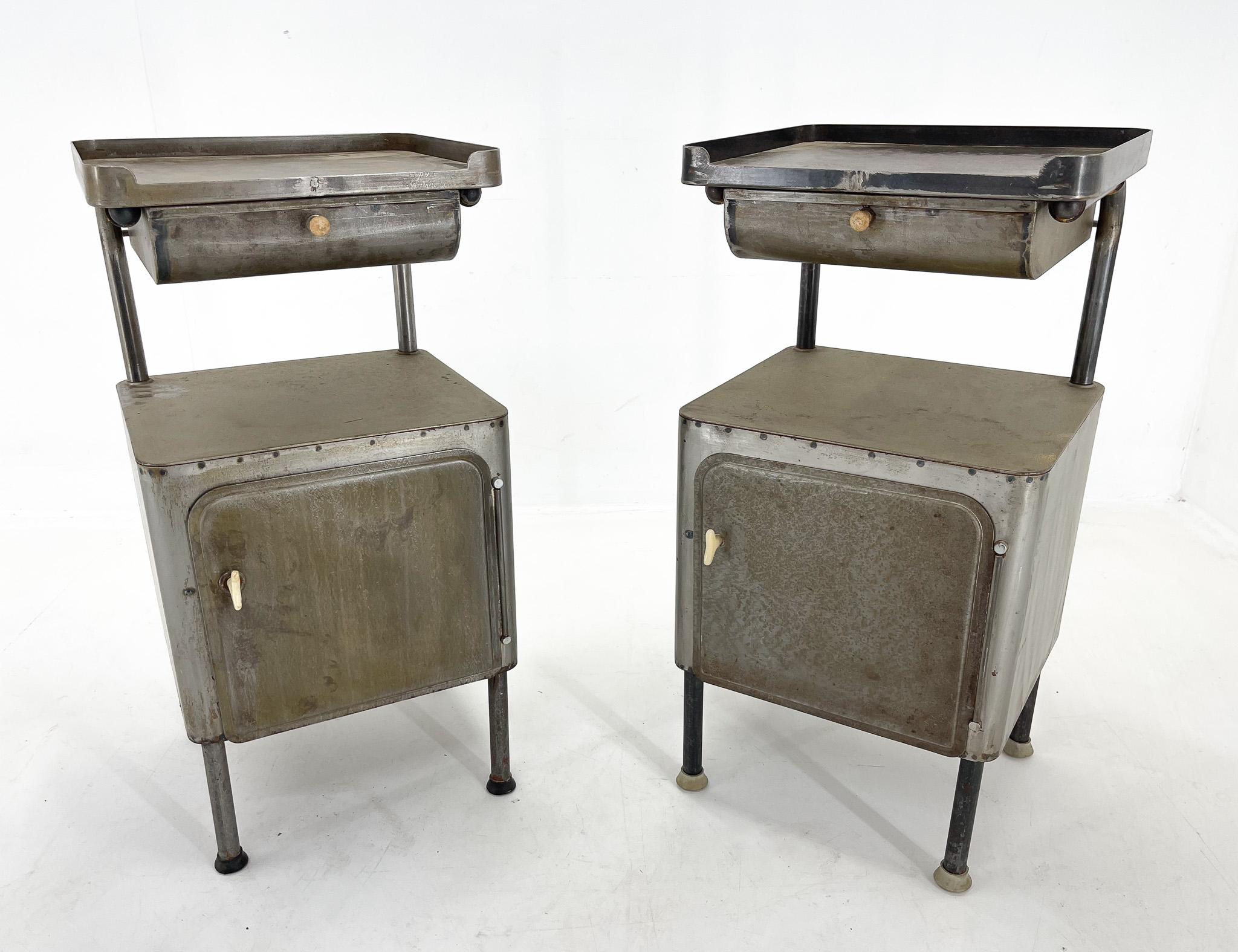 Pair of two unique metal nightstands from the 1920s. Brushed and cleaned.
