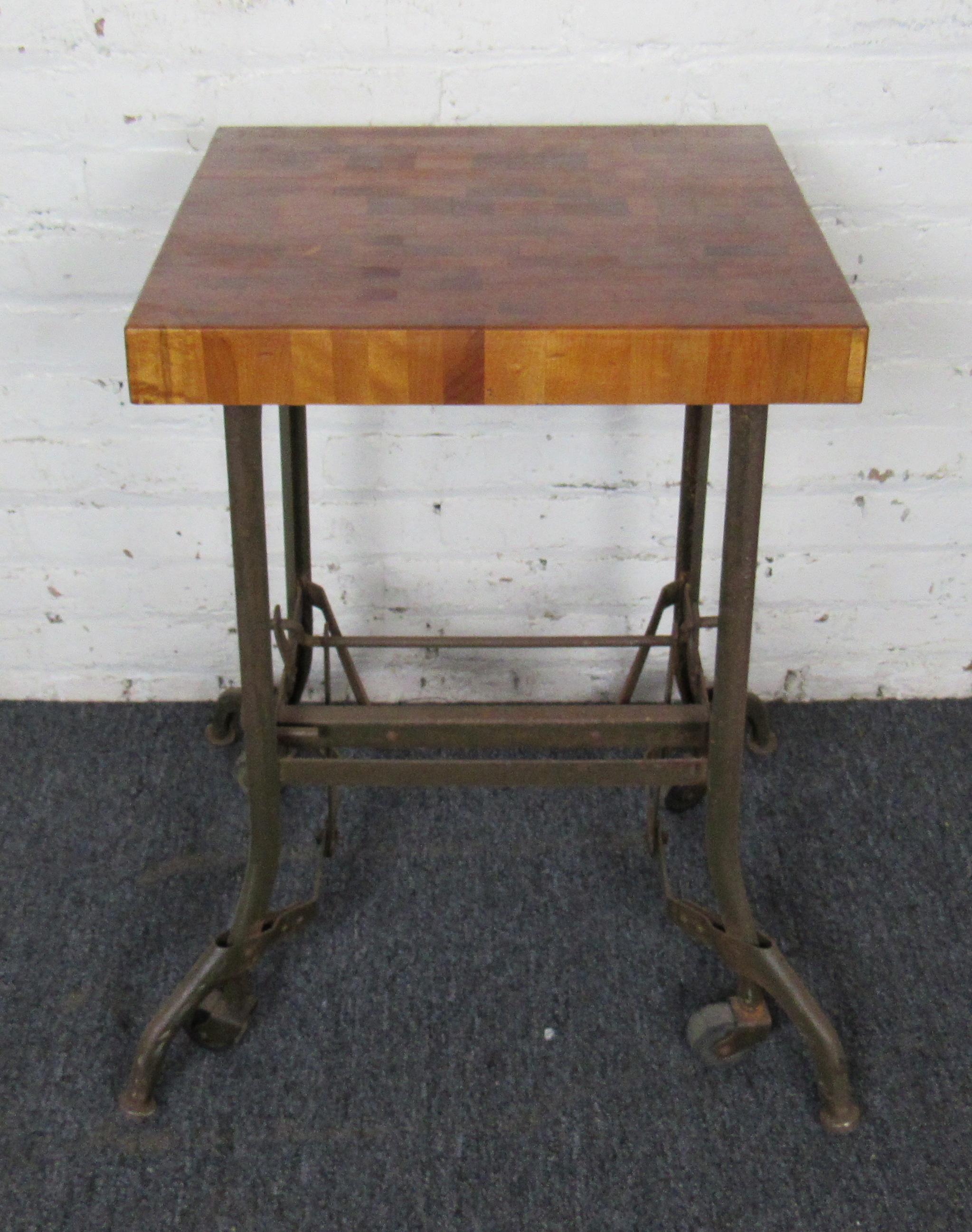 An unusual midcentury table that combines a sturdy butcher block top with a wheeled base. This vintage piece is versatile for home projects or living spaces and is sure to stand out anywhere.

Please confirm item location with dealer. (NJ/NY).