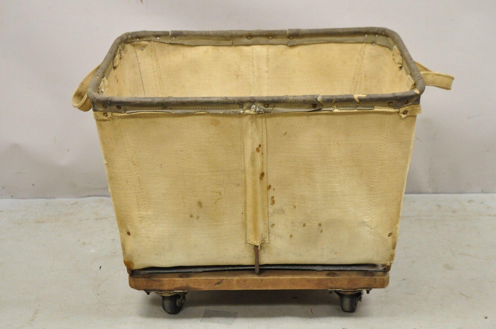 Vintage Industrial Canvas Rolling Storage Laundry Bin by Steel on Wheels. Item features rolling casters, canvas bin, very nice vintage item. Circa Mid to Late 20th Century. Measurements: 20