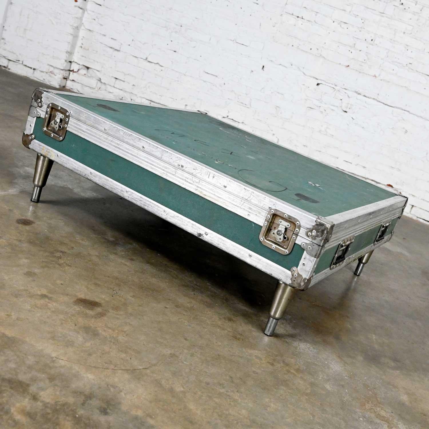 Awesome vintage industrial case low square turquoise coffee table with aluminum edges and chrome latches. Beautiful condition, keeping in mind that this is vintage and not new so will have signs of use and wear. In fact, it has a wonderful and