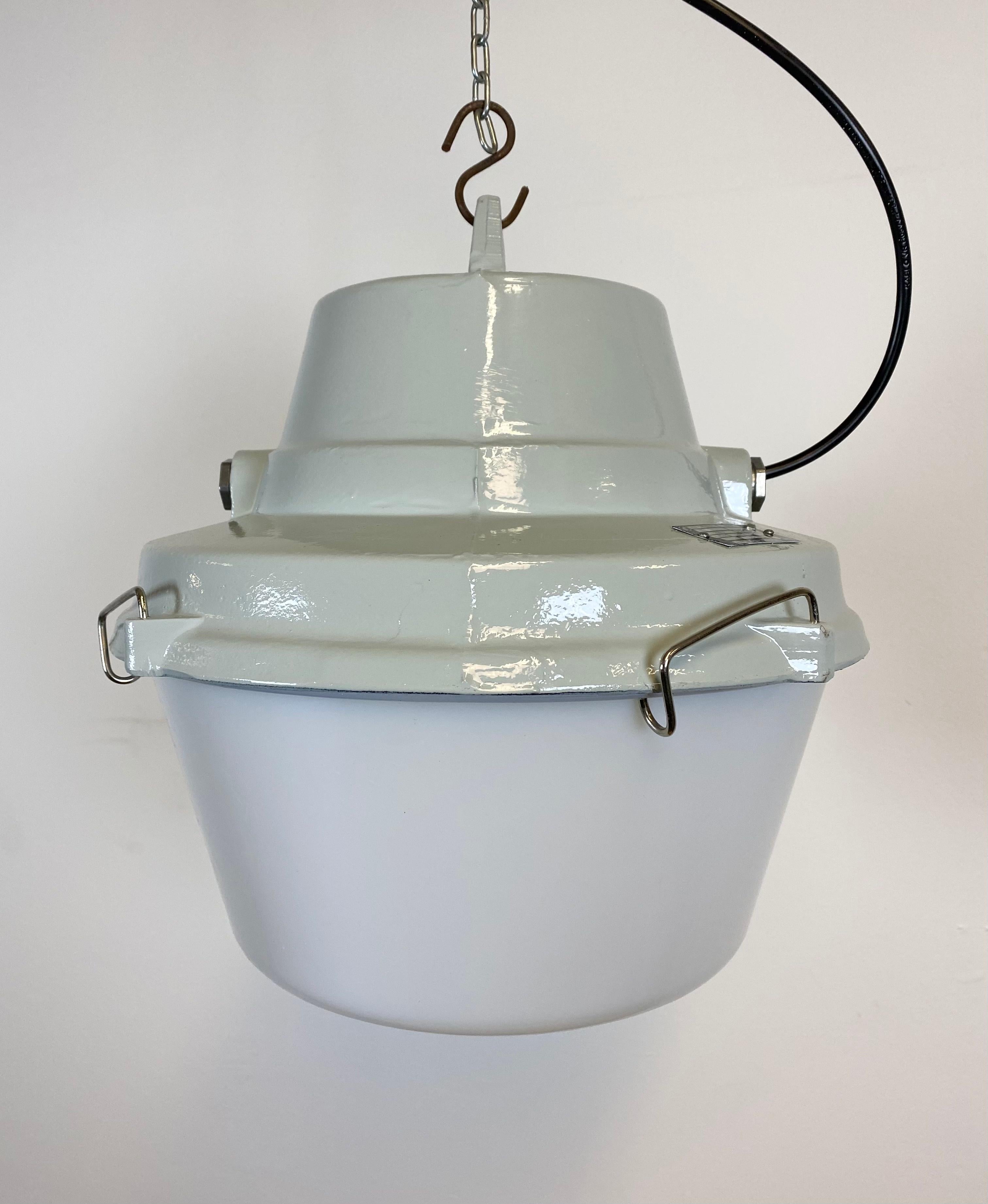 - Pendant lamp originally used in factories in former Czechoslovakia. 
- Made by Elektrosvit during the 1990s.
- Cast aluminium top.
- Milk plastic cover.
- New porcelain socket for E 27 lightbulbs and wire. 
- Weight: 3,5 kg.