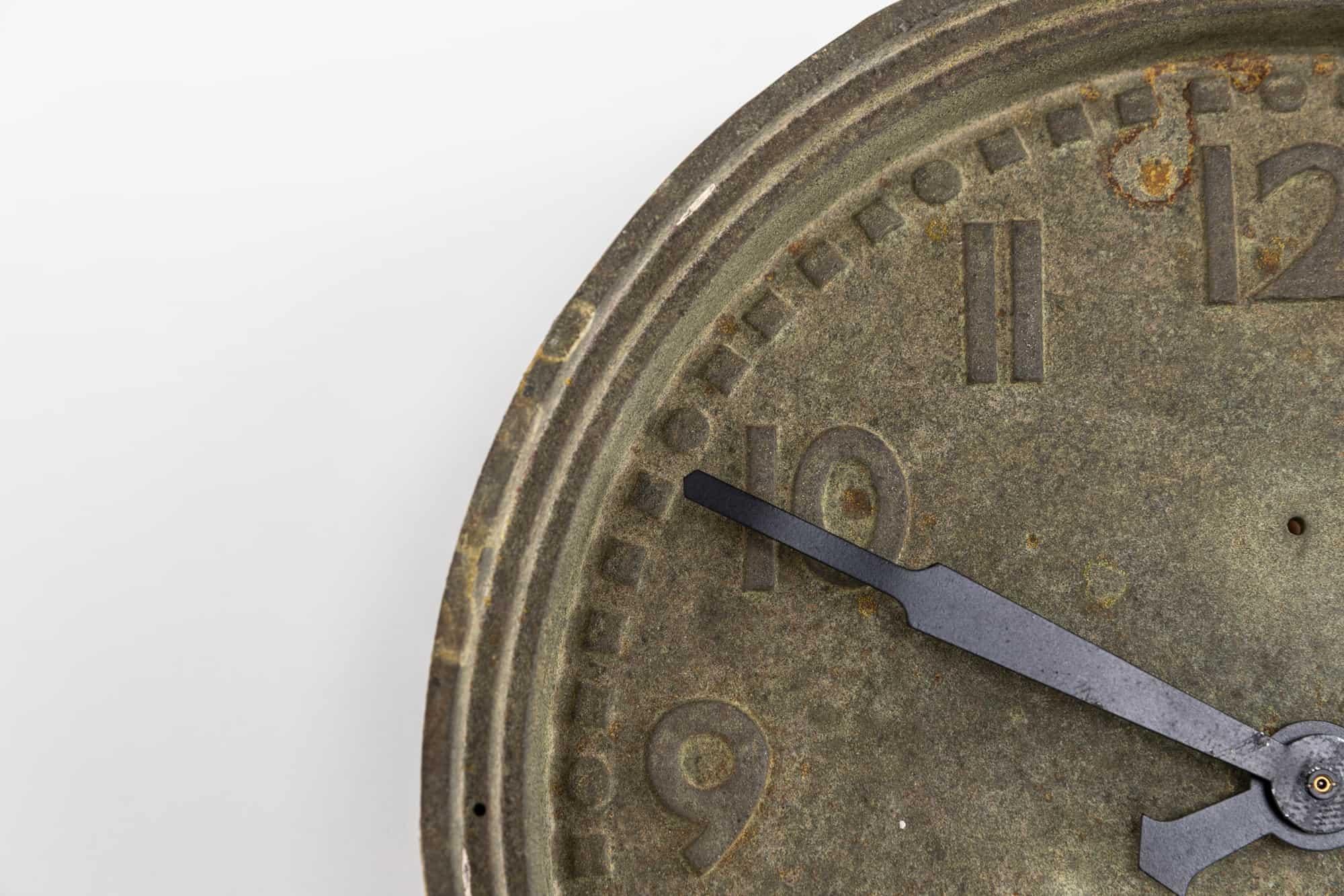 

Beautiful example of a cast iron factory wall clock made in England by Smiths. c.1930

Lesser seen than the iconic cast Gents of Leicester clock - made from a single piece of cast iron with debossed numerals and chapters. The whole had developed a