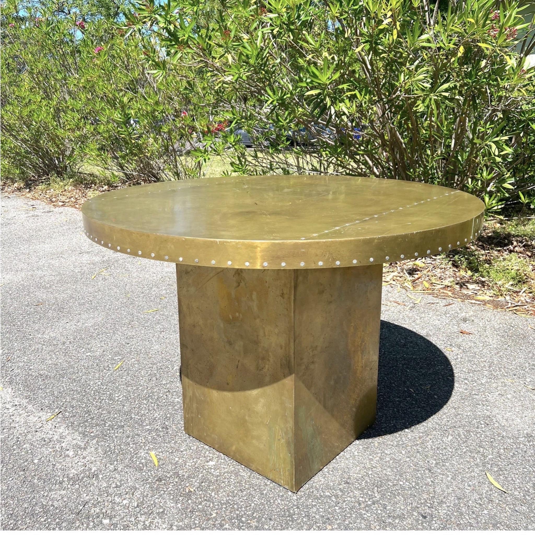 This fabulous industrial center table is brass and nails over wood. It is unmarked but highly in the style of Paul Evans. Excellent patina. Would love to see this paired with lucite barstools. 
37.50