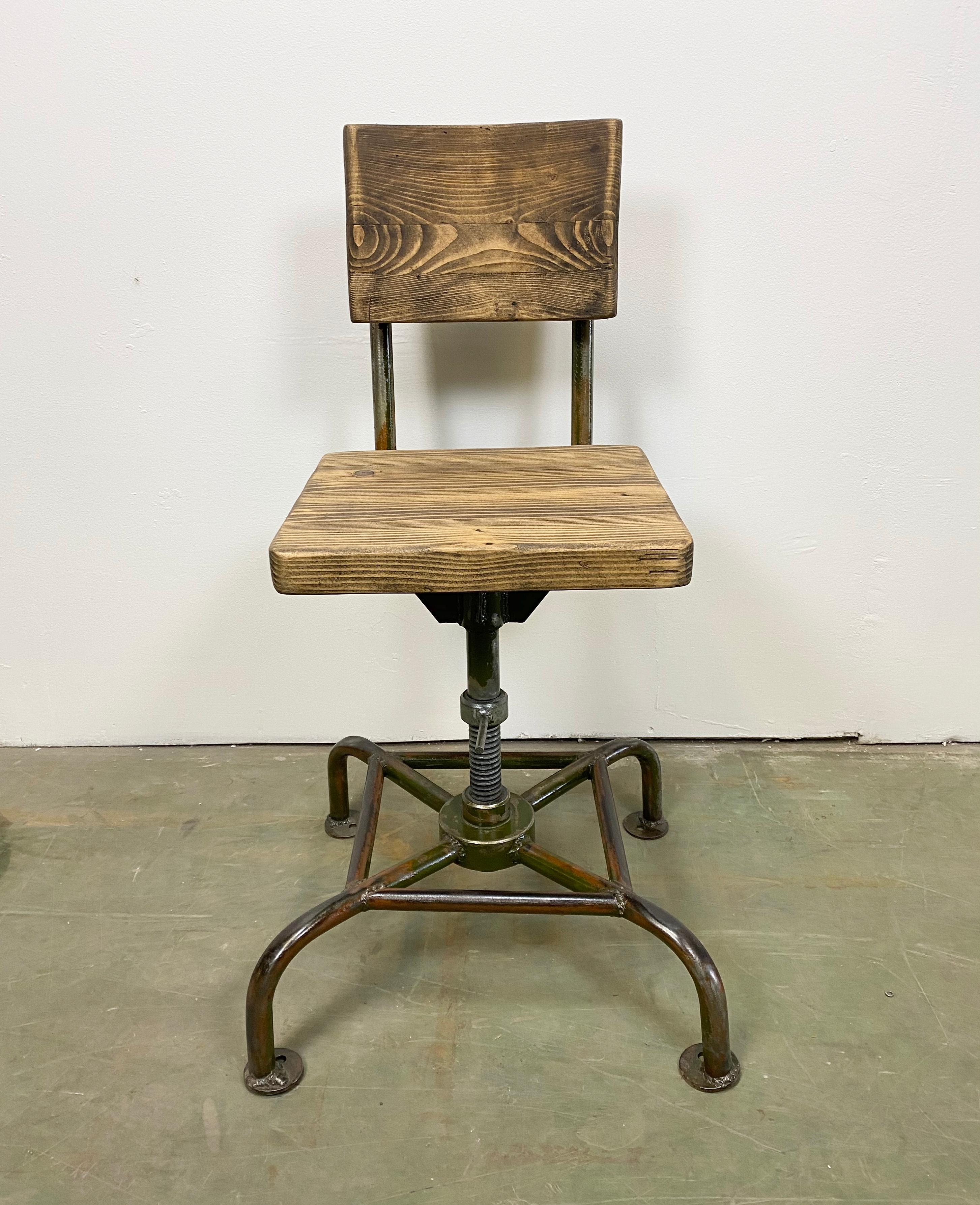 This industrial chair was made in former Czechoslovakia during the 1950s. It features an iron construction and a wooden seat and backrest. The chair is in very good vintage condition. Weight of the chair is 16 kg.
Additional dimensions:
Total