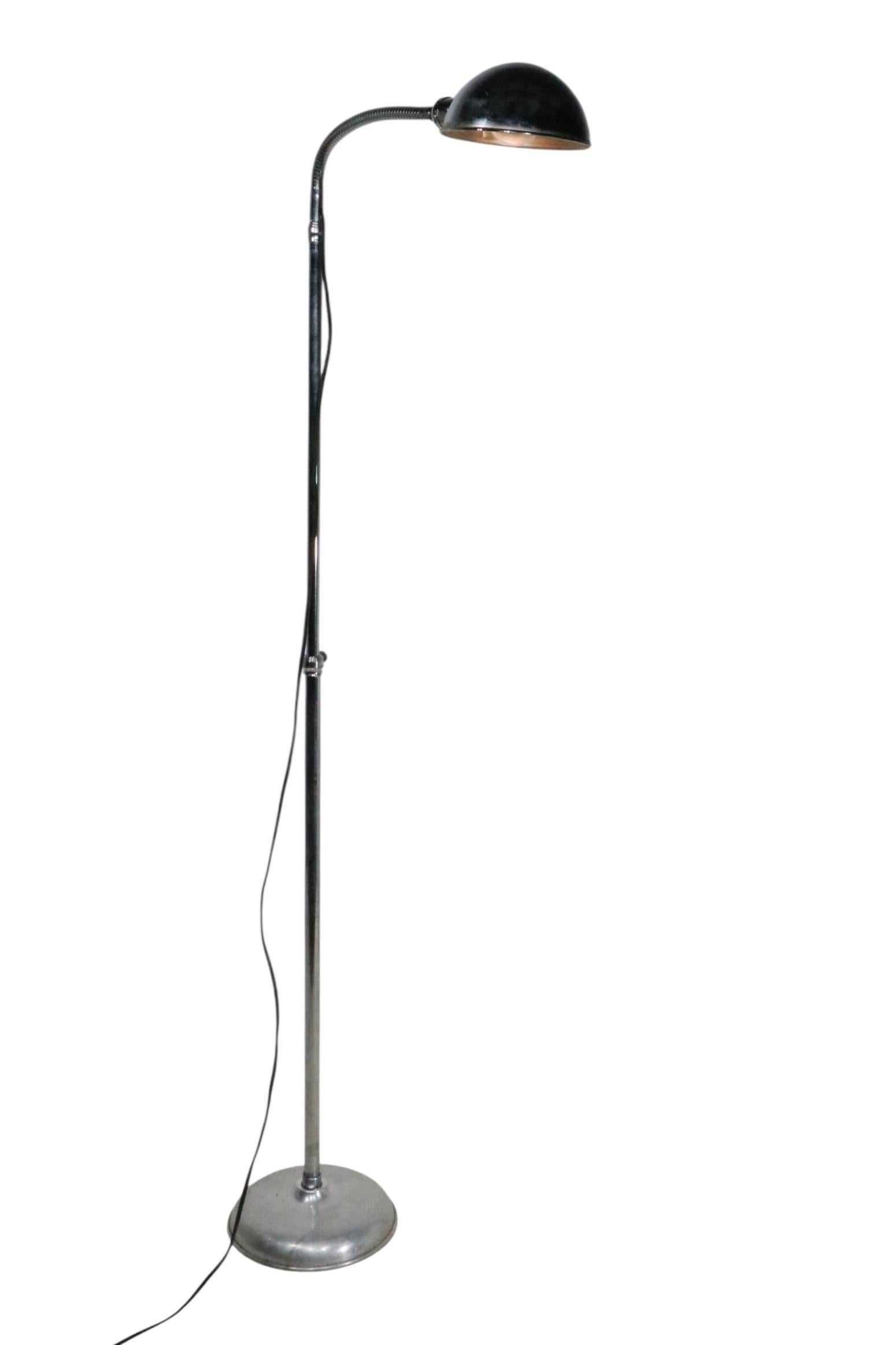 Exceptional Pharmacy, Reading, Doctors, adjustable chrome and aluminum floor lamp, in very good, original, clean and working condition. The lamp features a height adjustment ( 36