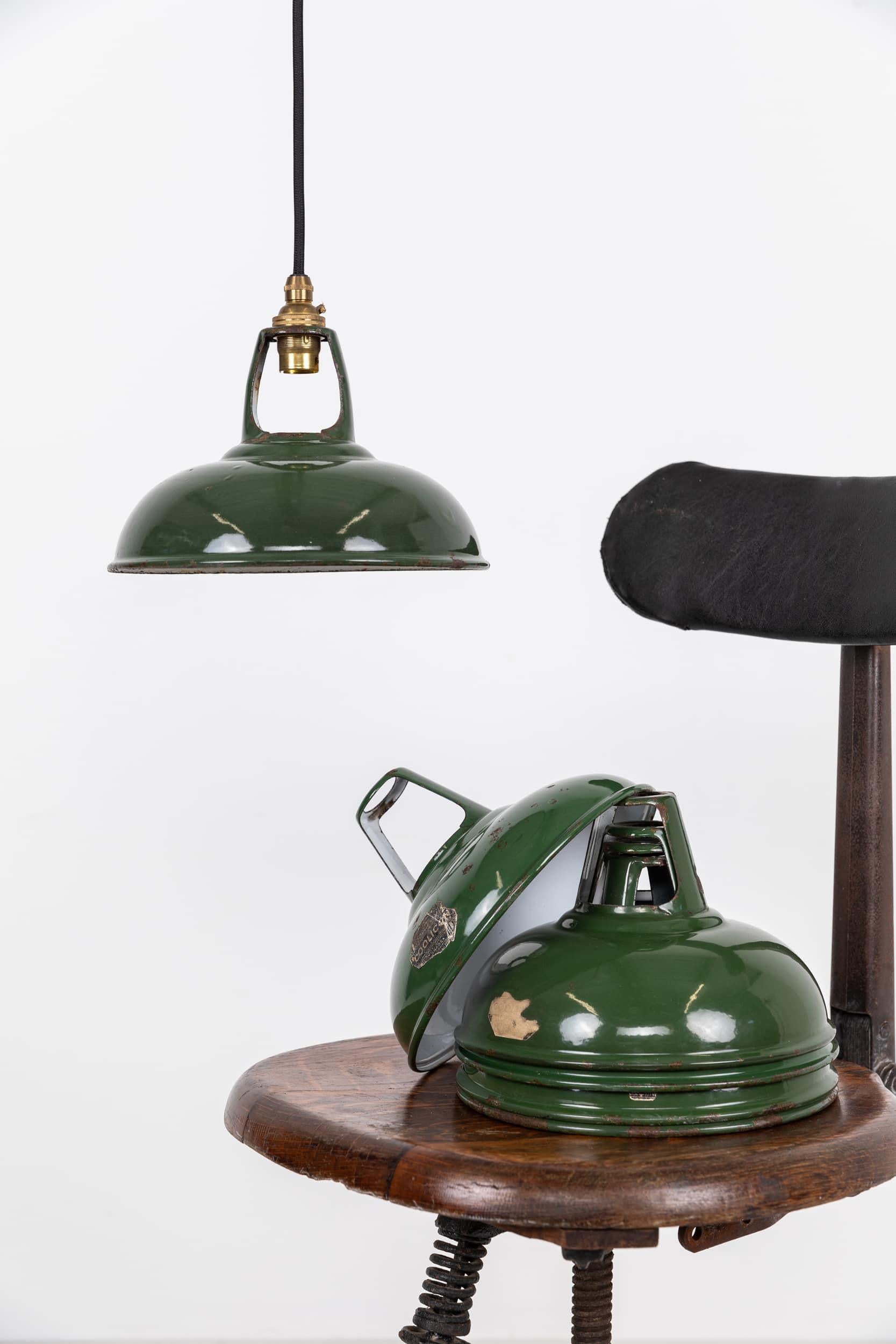 Diminutive vitreous enamel pendant lights by Coolicon. c.1930

In amazing original condition, with little wear to the enamel. Some shades retain their original paper label. Price is per lamp.

Resold by GEC as shown in an original catalogue from