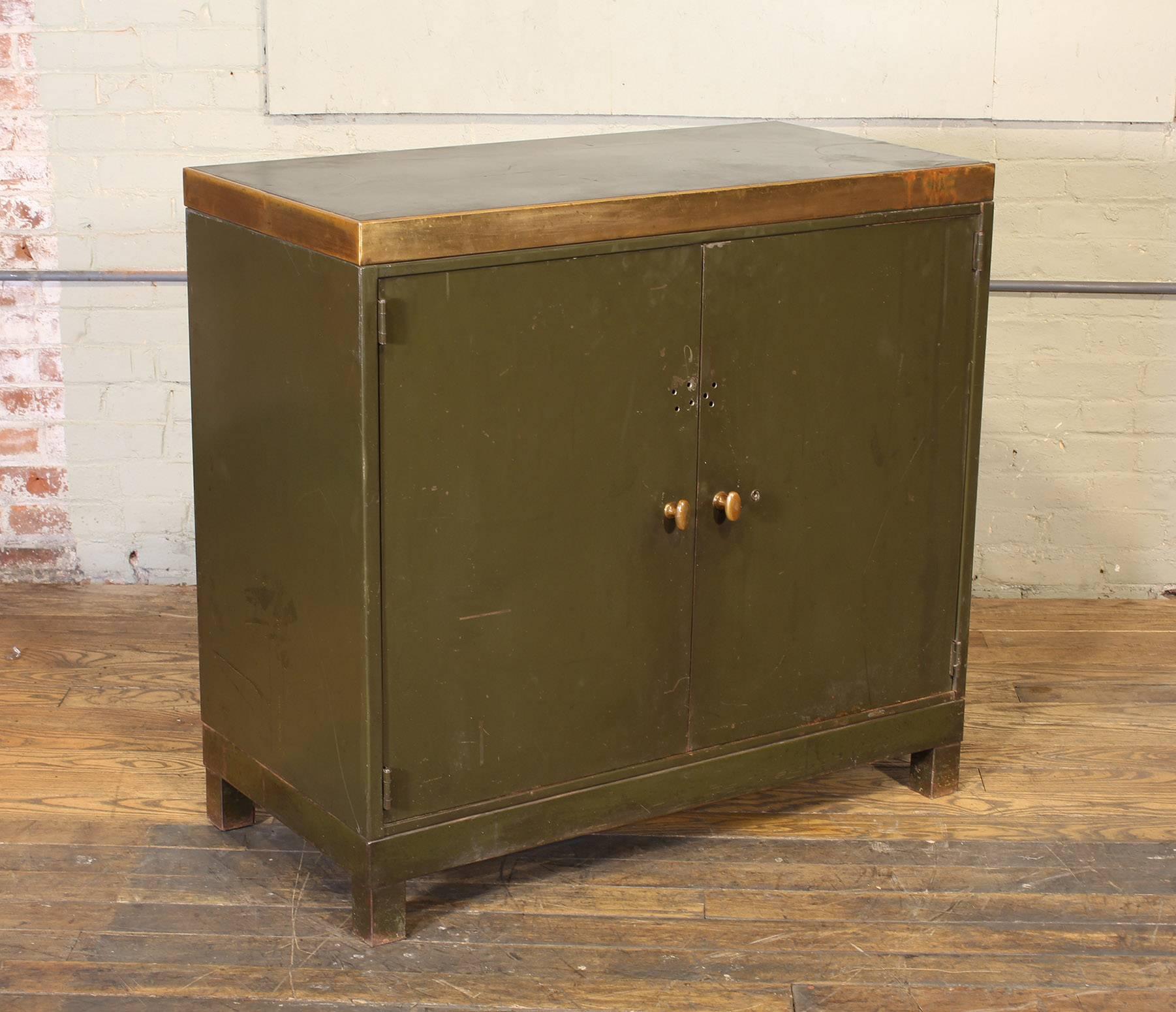 Industrial style vintage metal, brass and copper shelved storage cabinet or credenza. Features a removable laminate, metal and weathered copper top, brass handles and two adjustable shelves. Measures: 38