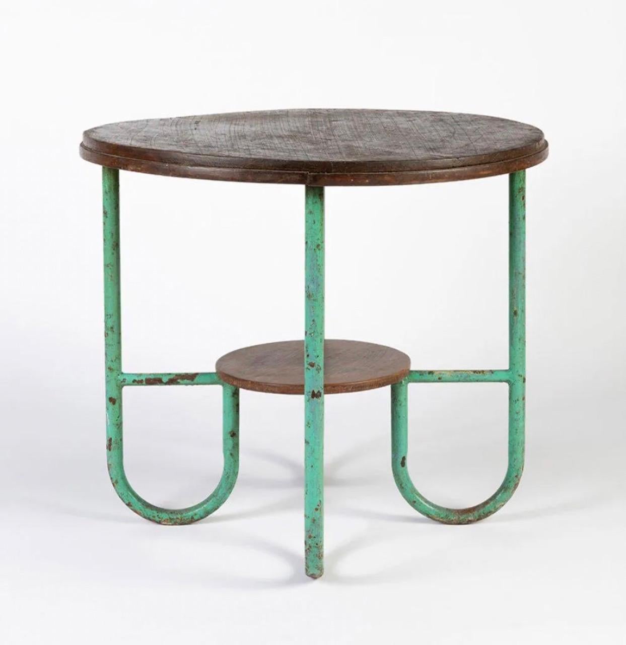 Gorgeous French side table in walnut and patinated steel.

France, 1930's. 

Shows wear consistent with age and use.