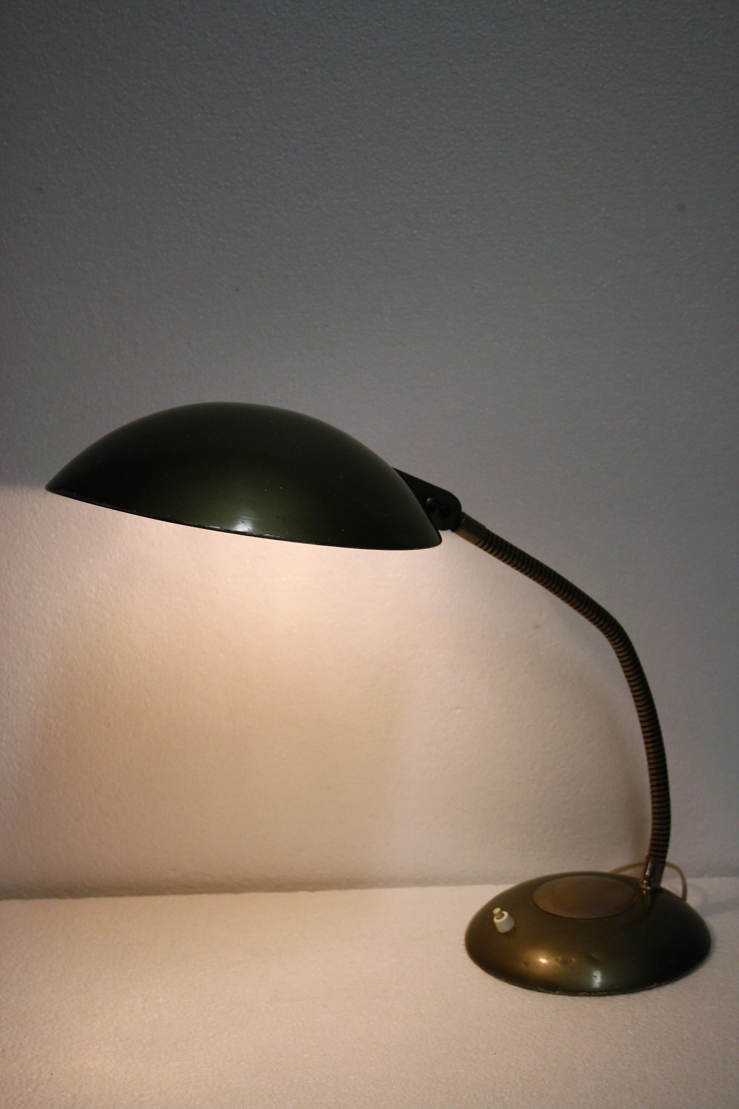 Industrial table lamp manufactured by Erpe.

This flexible desk lamp is made from aluminum and has a green/grey colour.

It is labeled inside the shade.

Erpe is a Belgium company that used to produce lamps in the Art Deco era and in the